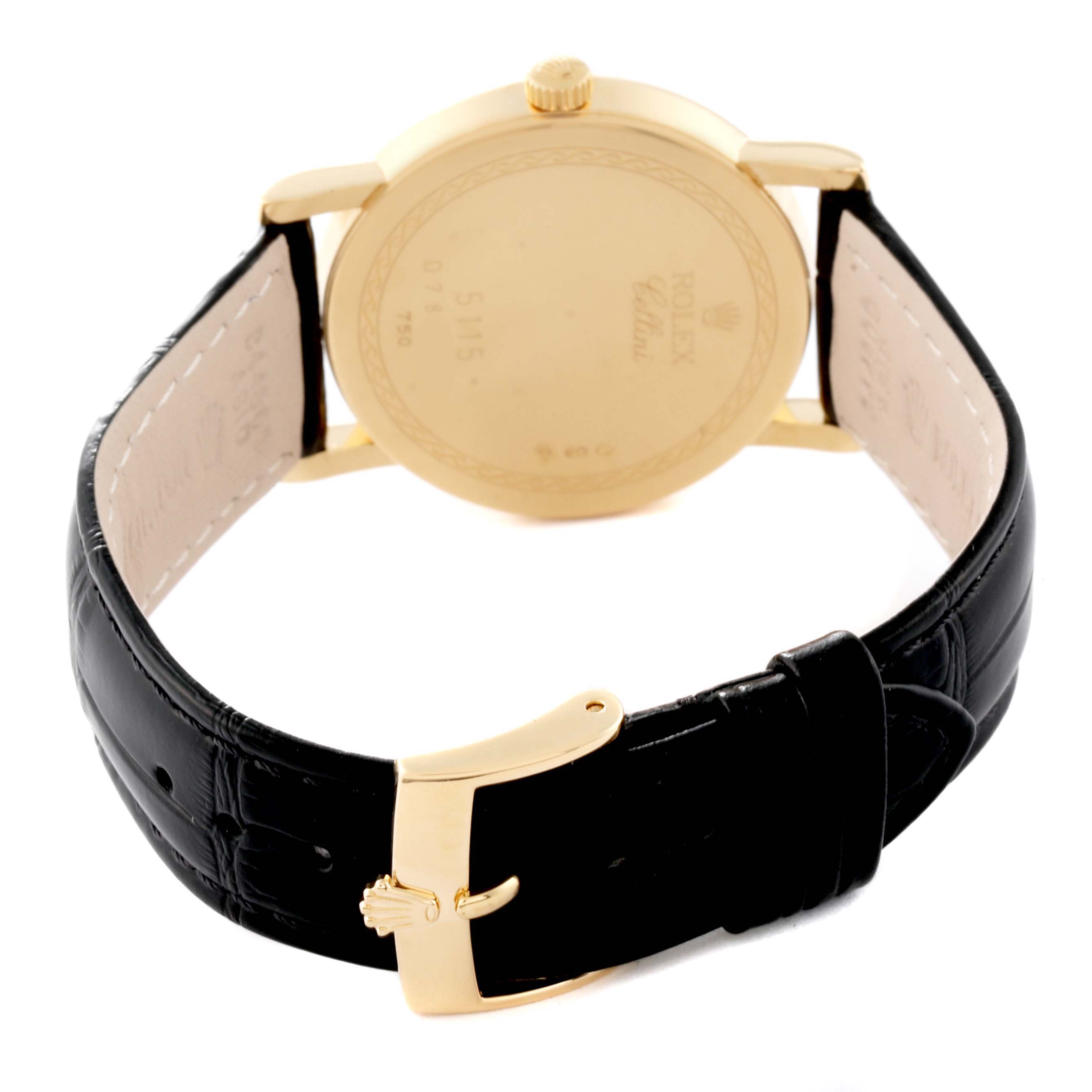 The image shows the back view of a Rolex Cellini 5115 Men's Yellow Gold Black Dial 5115 Men's Yellow Gold Black Dial watch, featuring its gold case back, crown, and black leather strap with gold buckle.