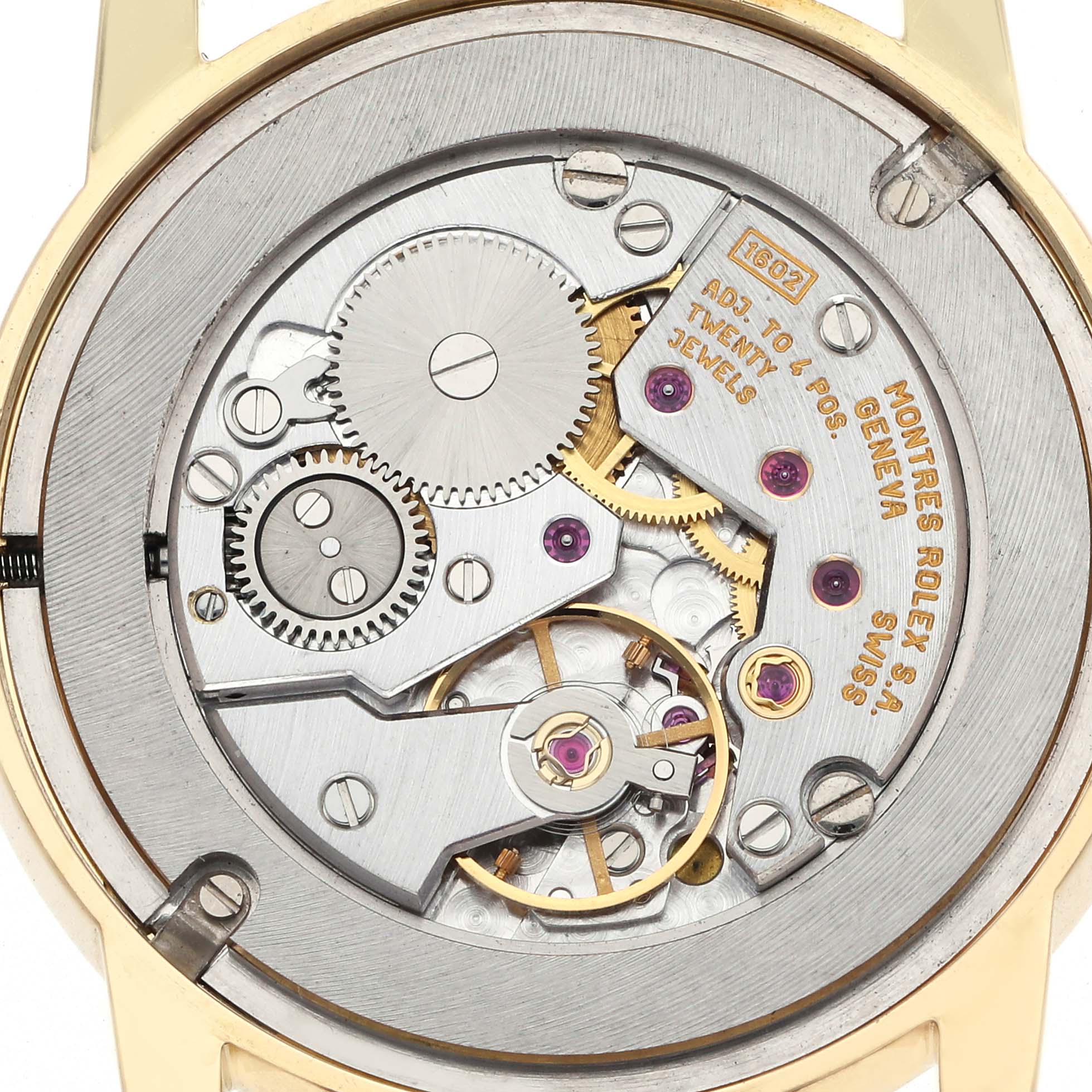 The image shows the back view of a Rolex Cellini 5116/8 Men's Yellow Gold Silver Dial 5116/8 Men's Yellow Gold Silver Dial watch, highlighting its intricate mechanical movement.