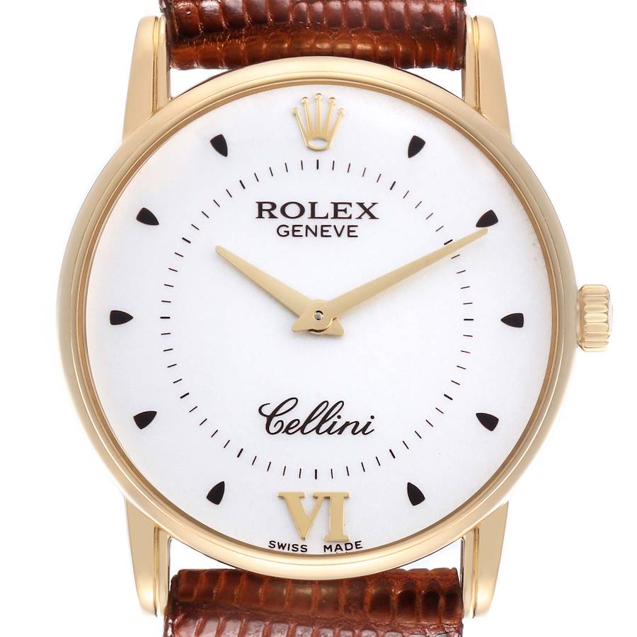 The Rolex Cellini watch is shown from the front, featuring the face, hands, crown, and part of the leather strap.