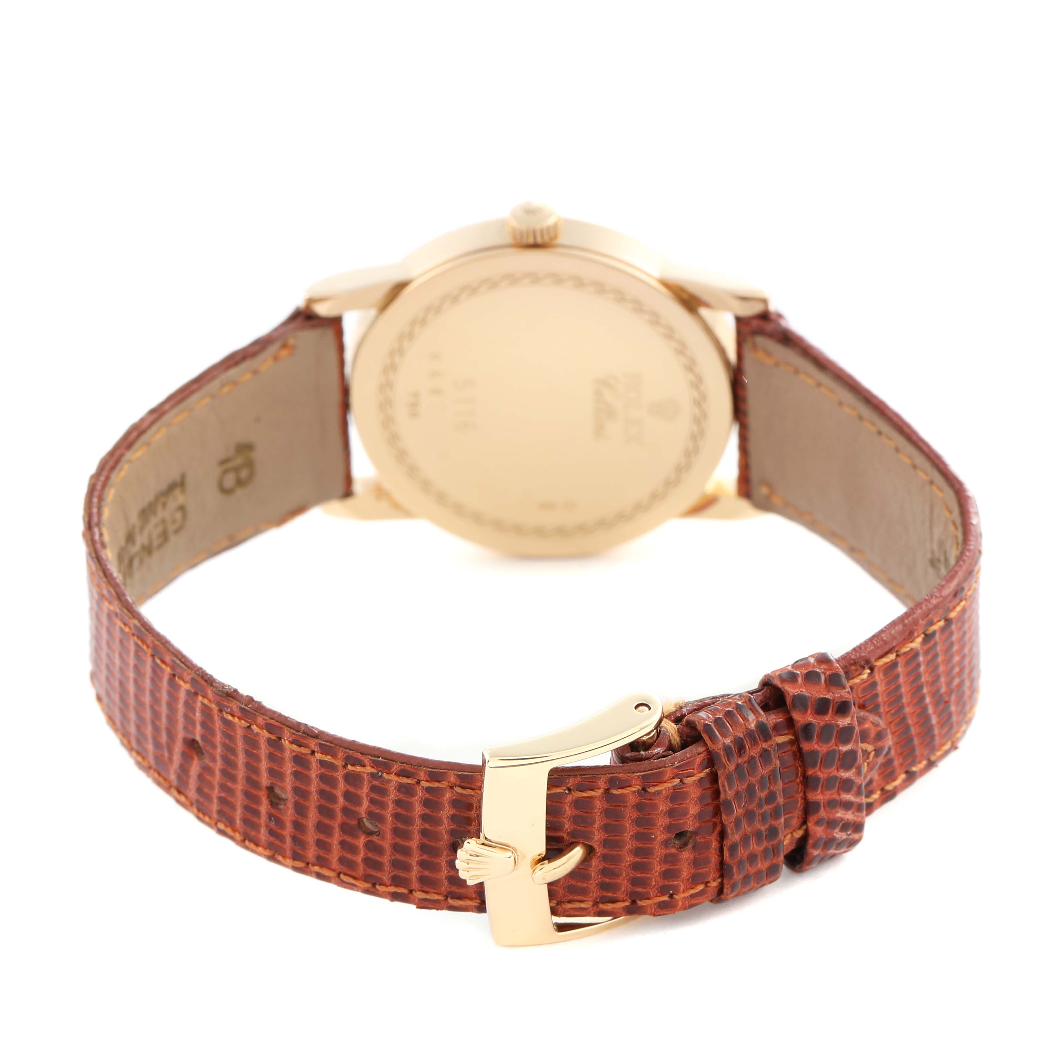 The image shows the back view of a Rolex Cellini 5116/8 Men's Yellow Gold Silver Dial 5116/8 Men's Yellow Gold Silver Dial watch, highlighting its gold caseback and brown textured leather strap with a buckle.