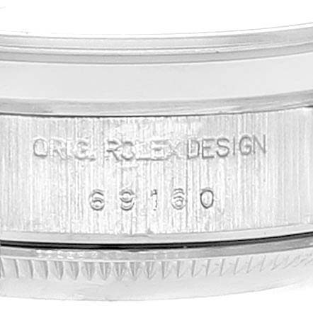 This image shows a close-up of the case side of the Rolex Date 69160 Women's Stainless Steel Black Dial 69160 Women's Stainless Steel Black Dial model, engraved with "ORIG ROLEX DESIGN" and the model number "69160".