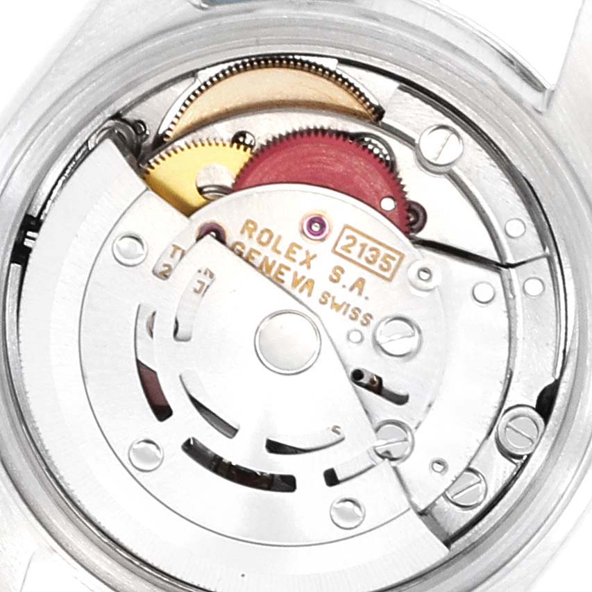 The image shows the internal movement mechanism of a Rolex Date 69160 Women's Stainless Steel Black Dial 69160 Women's Stainless Steel Black Dial model watch from a close-up angle.