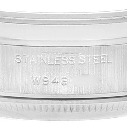 Close-up of the side of a Rolex Date 69160 Women's Stainless Steel Black Dial 69160 Women's Stainless Steel Black Dial model watch, showing "Stainless Steel" engraving and a part of the bezel.