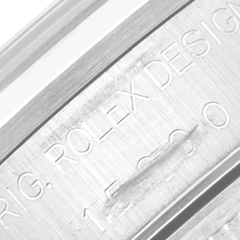 The image shows a close-up angle of the serial engraving on the case side of a Rolex Date 15200 Men's Stainless Steel Blue Dial 15200 Men's Stainless Steel Blue Dial watch.