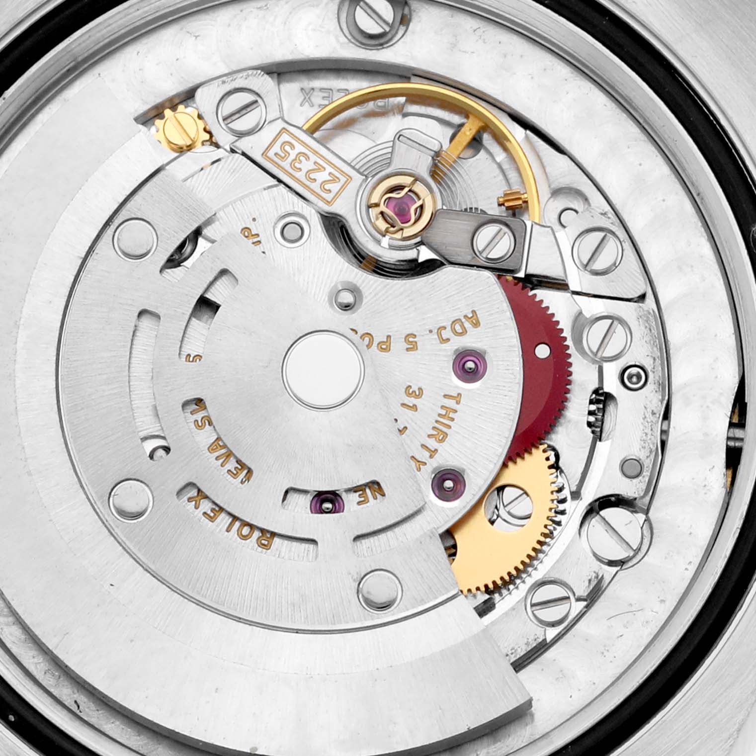 The image shows the intricate back view of the movement mechanism of a Mid-Size Rolex watch.