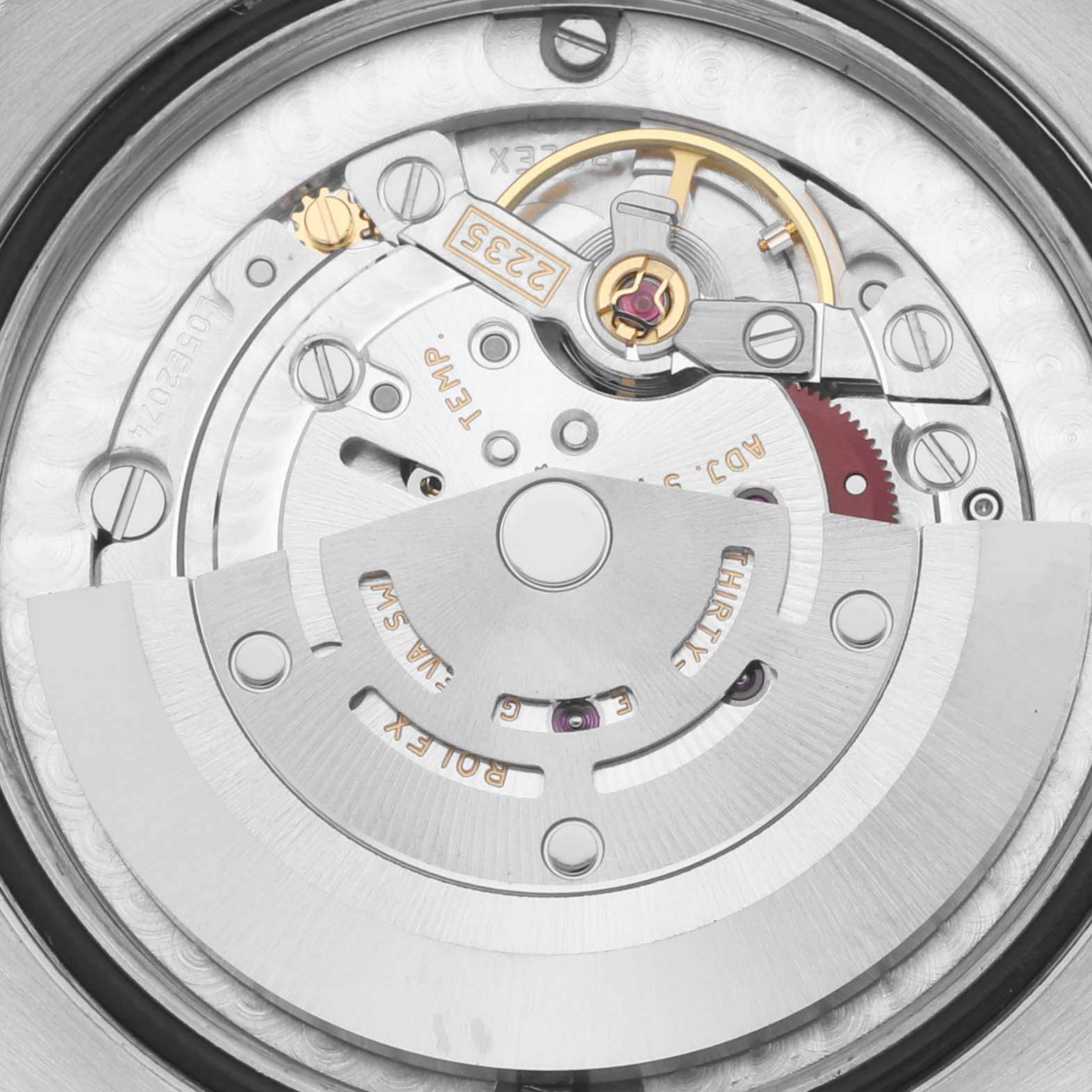 The image shows the movement mechanism of a Rolex Mid-Size 178273 Women's Steel and Gold (two tone) Mother of Pearl Dial 178273 Women's Steel and Gold (two tone) Mother of Pearl Dial watch from a top-down angle, highlighting the rotor and inner components.