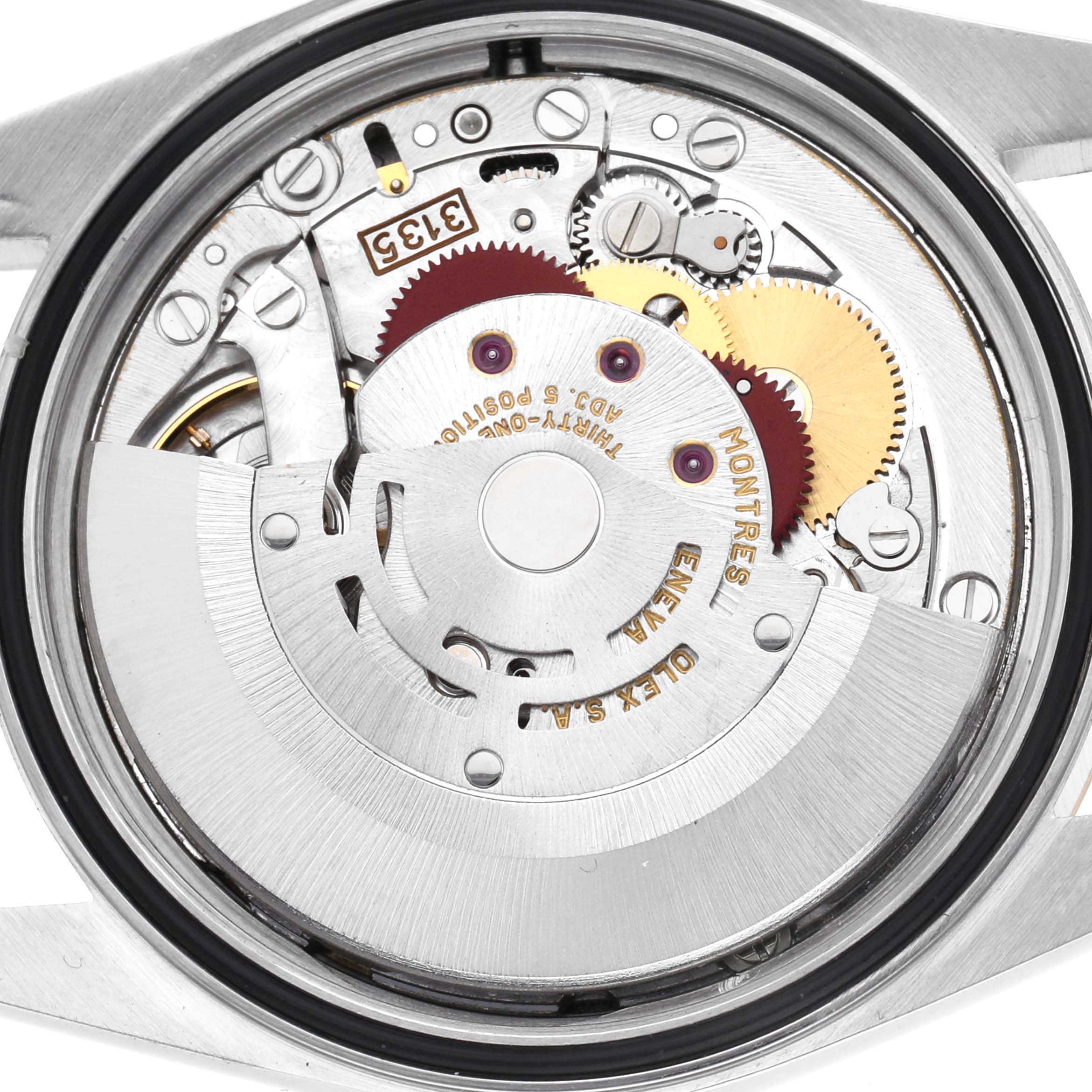 The image shows the movement of a Rolex Datejust 16233 Men's Steel and Gold (two tone) Champagne Dial 16233 Men's Steel and Gold (two tone) Champagne Dial watch viewed from the back with visible gears and rotors.
