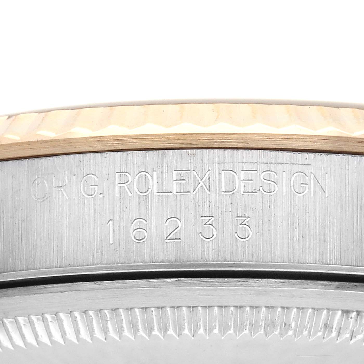 The image shows the side view of a Rolex Datejust 16233 Men's Steel and Gold (two tone) Champagne Dial 16233 Men's Steel and Gold (two tone) Champagne Dial case with visible model number and fluted bezel.
