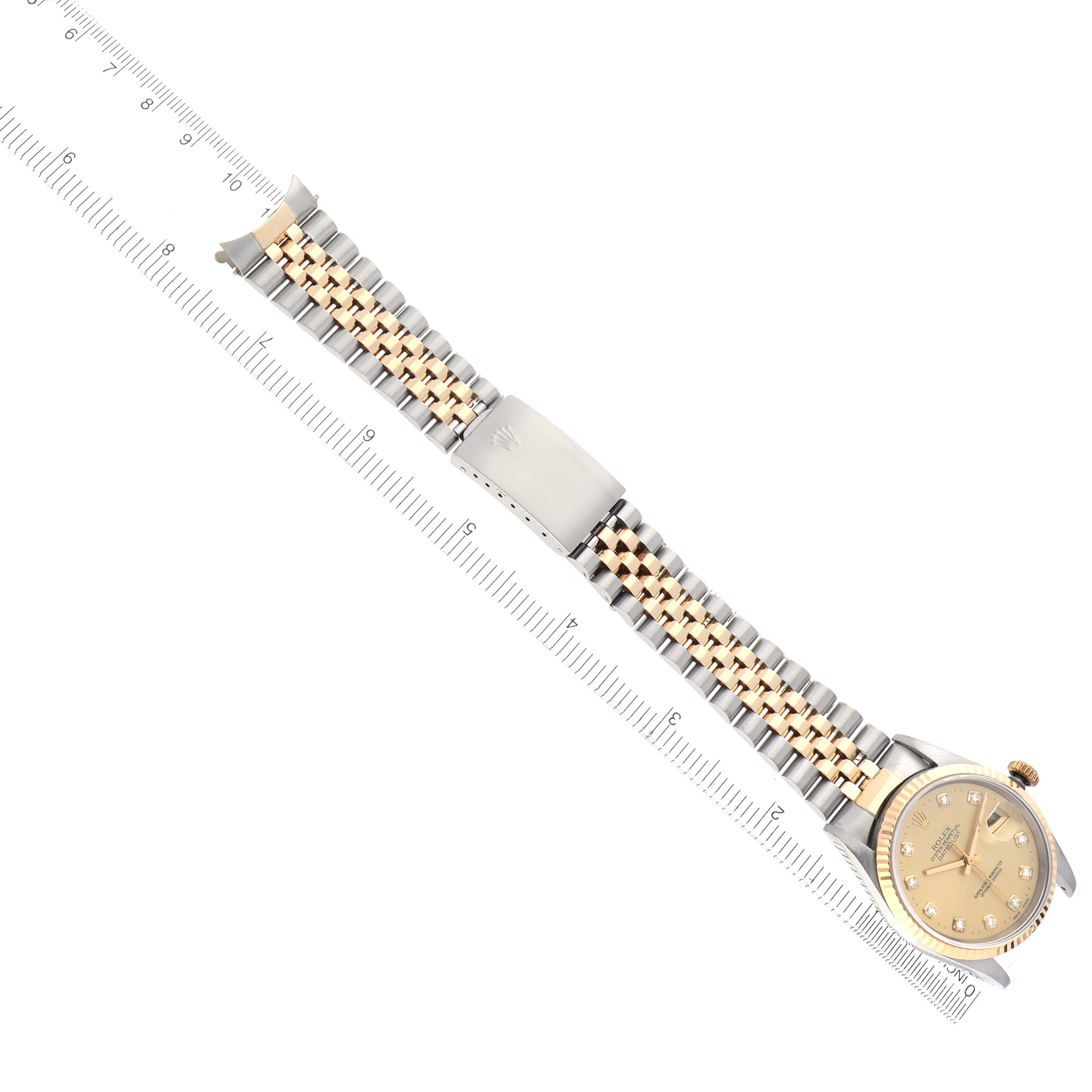 The Rolex Datejust 16233 Men's Steel and Gold (two tone) Champagne Dial 16233 Men's Steel and Gold (two tone) Champagne Dial watch is shown from a top-down angle, highlighting its two-tone bracelet and face.