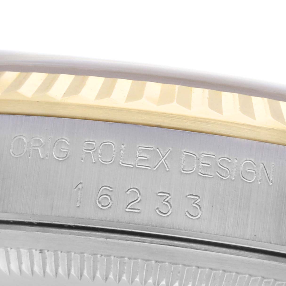 The image shows a close-up of the side case of a Rolex Datejust 16233 Men's Steel and Gold (two tone) Champagne Dial 16233 Men's Steel and Gold (two tone) Champagne Dial, highlighting the fluted bezel and model number 16233 engraving.