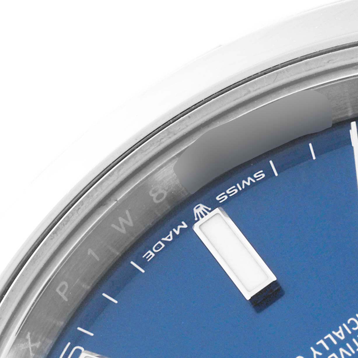 This close-up of the Rolex Datejust 41 126300 Men's Stainless Steel Blue Dial 126300 Men's Stainless Steel Blue Dial shows a part of the blue dial, bezel, and the "SWISS MADE" text near the 6 o'clock position.