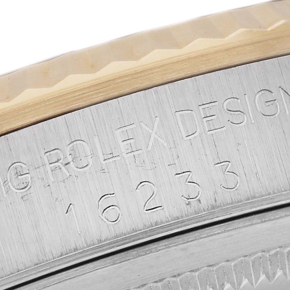 This image shows a close-up of the bezel and rehaut engraving on a Rolex Datejust 16233 Men
s Steel and Gold (two tone) Silver Dial 16233 Men
s Steel and Gold (two tone) Silver Dial model.