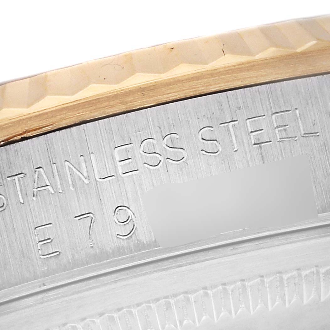 This close-up shows the stainless steel bezel and part of the model number on the Rolex Datejust 16233 Men
s Steel and Gold (two tone) Silver Dial 16233 Men
s Steel and Gold (two tone) Silver Dial watch.