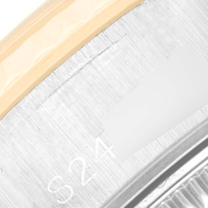 This close-up image shows a detailed view of the metallic and gold sections of the bezel on a Rolex Datejust 69173 Women's Steel and Gold (two tone) Champagne Dial 69173 Women's Steel and Gold (two tone) Champagne Dial watch.