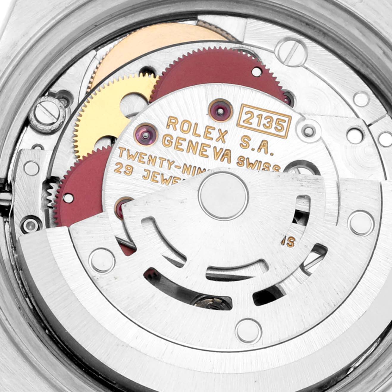 The image shows the intricate inner mechanics of a Rolex Datejust 69173 Women's Steel and Gold (two tone) Champagne Dial 69173 Women's Steel and Gold (two tone) Champagne Dial watch, highlighting its movement and gears.