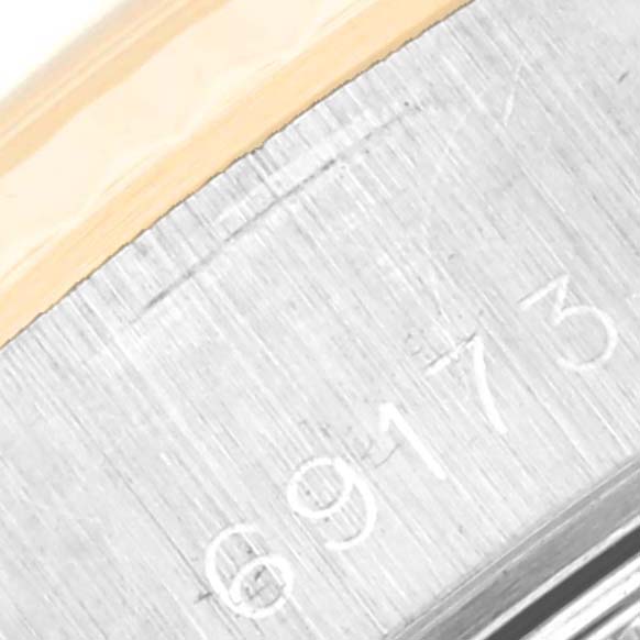 The image shows a close-up of the engraved serial number on the side of the Rolex Datejust 69173 Women's Steel and Gold (two tone) Champagne Dial 69173 Women's Steel and Gold (two tone) Champagne Dial watch.