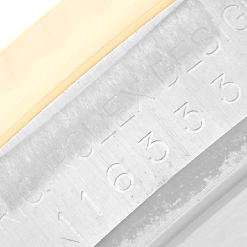 This is a close-up of the Rolex Datejust 41 116333 Men's Steel and Gold (two tone) Champagne Dial 116333 Men's Steel and Gold (two tone) Champagne Dial bezel and rehaut with engraving.