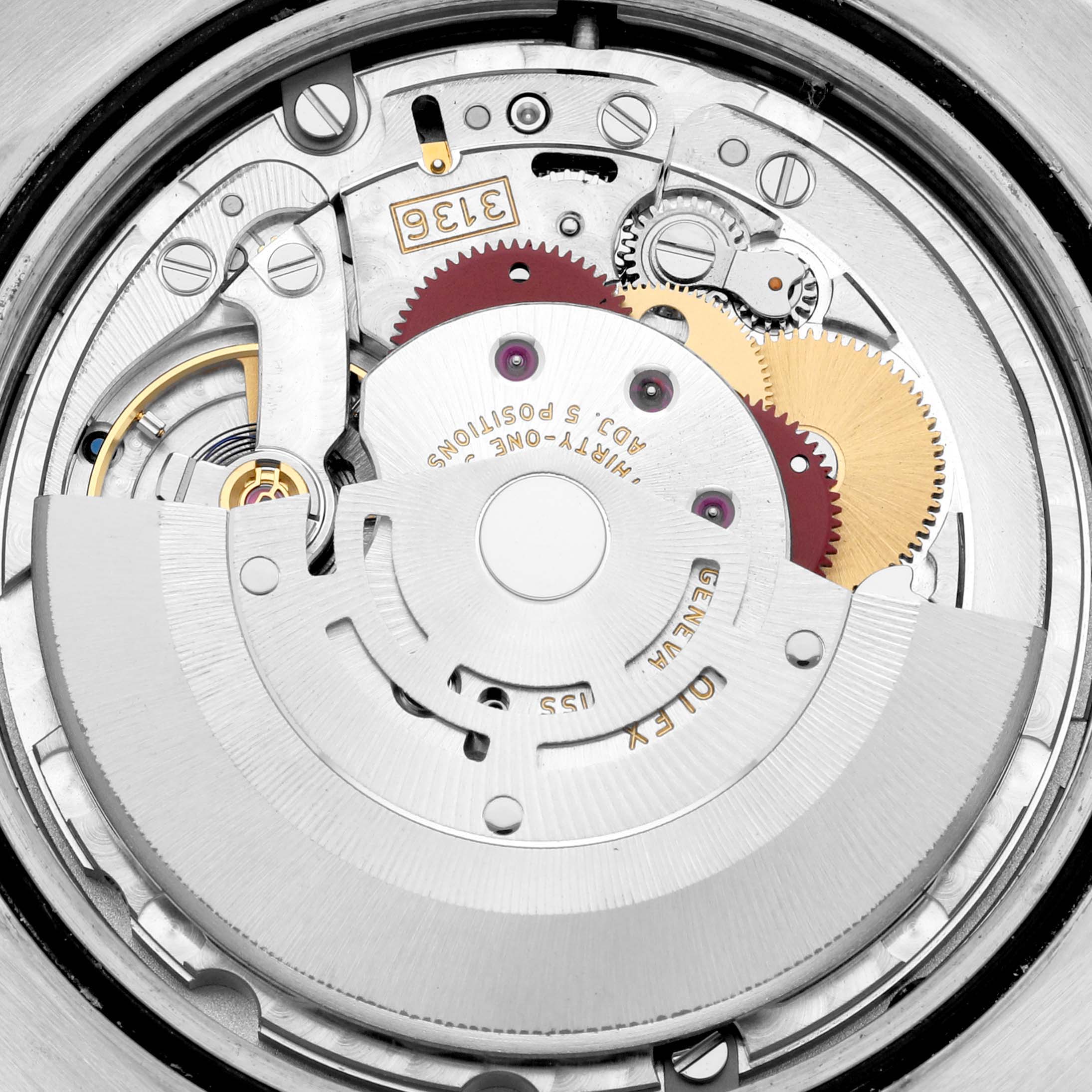 This image shows a close-up view of the inner mechanism of a Rolex Datejust 41 116333 Men's Steel and Gold (two tone) Champagne Dial 116333 Men's Steel and Gold (two tone) Champagne Dial, highlighting gears and the rotor.