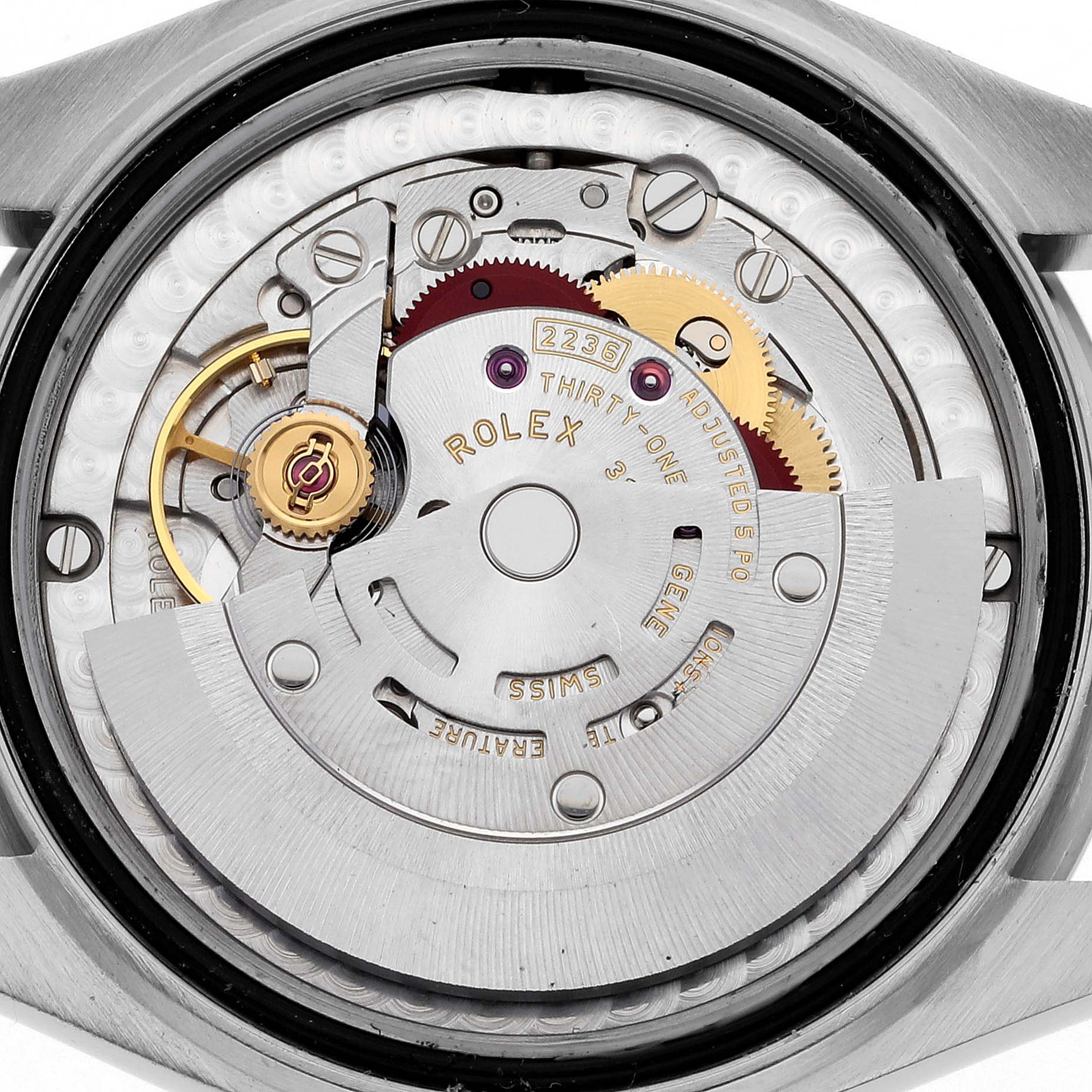 The image shows the inner mechanism of a Mid-Size Rolex watch, viewed from the back cover, displaying its intricate components.