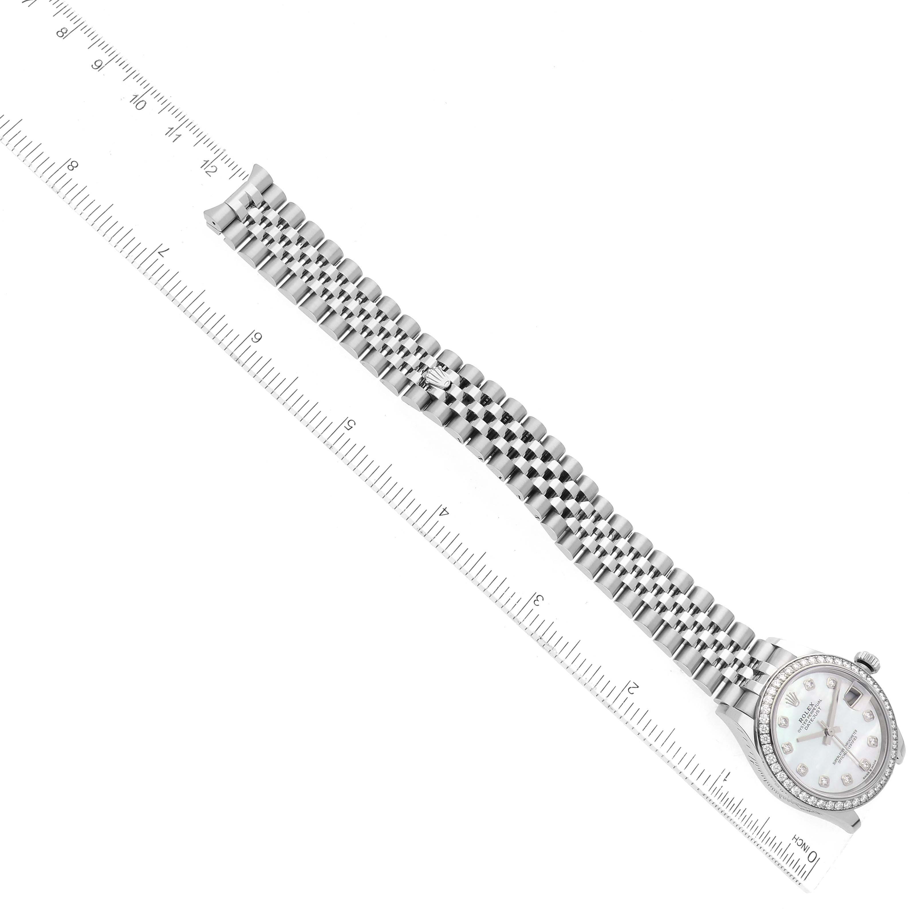 The image shows a top-down view of a Rolex Mid-Size 278384 Women's Stainless Steel Mother of Pearl Dial 278384 Women's Stainless Steel Mother of Pearl Dial watch, highlighting the dial, bezel, bracelet, and a ruler for scale.
