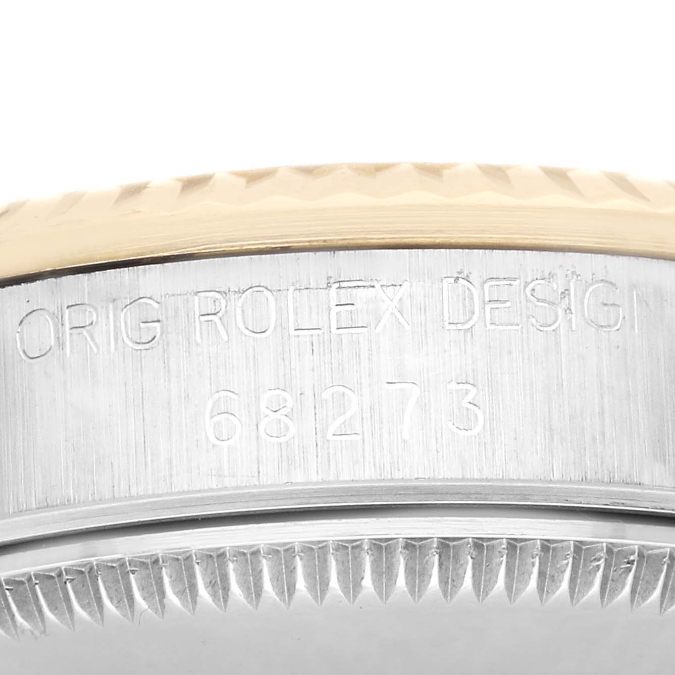 The image shows a close-up side view of the case and bezel of a Mid-Size Rolex watch, featuring its design code and model number 68273.