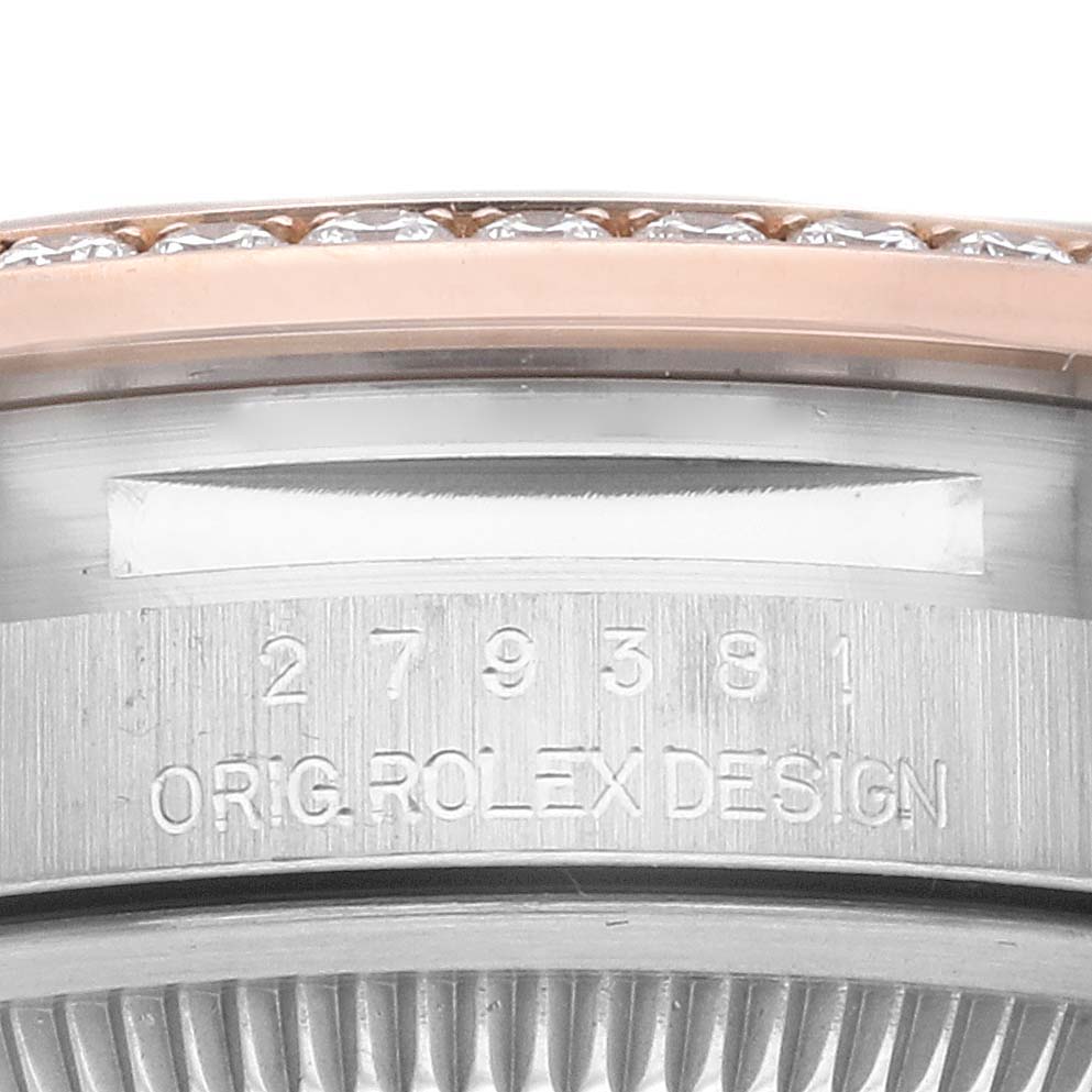 This close-up image shows the serial number engraving on the side of a bezel of the Rolex Datejust 279381 Women's Steel and Gold (two tone) Brown Dial 279381 Women's Steel and Gold (two tone) Brown Dial watch.