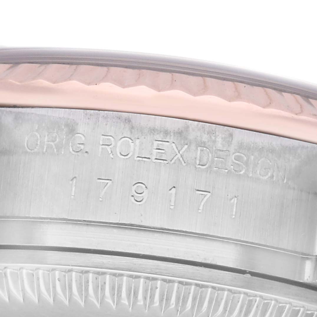 The image shows the engraved side of a Rolex Datejust 179171 Women's Steel and Gold (two tone) White Dial 179171 Women's Steel and Gold (two tone) White Dial watch case with "ORIG. ROLEX DESIGN" and a reference number.