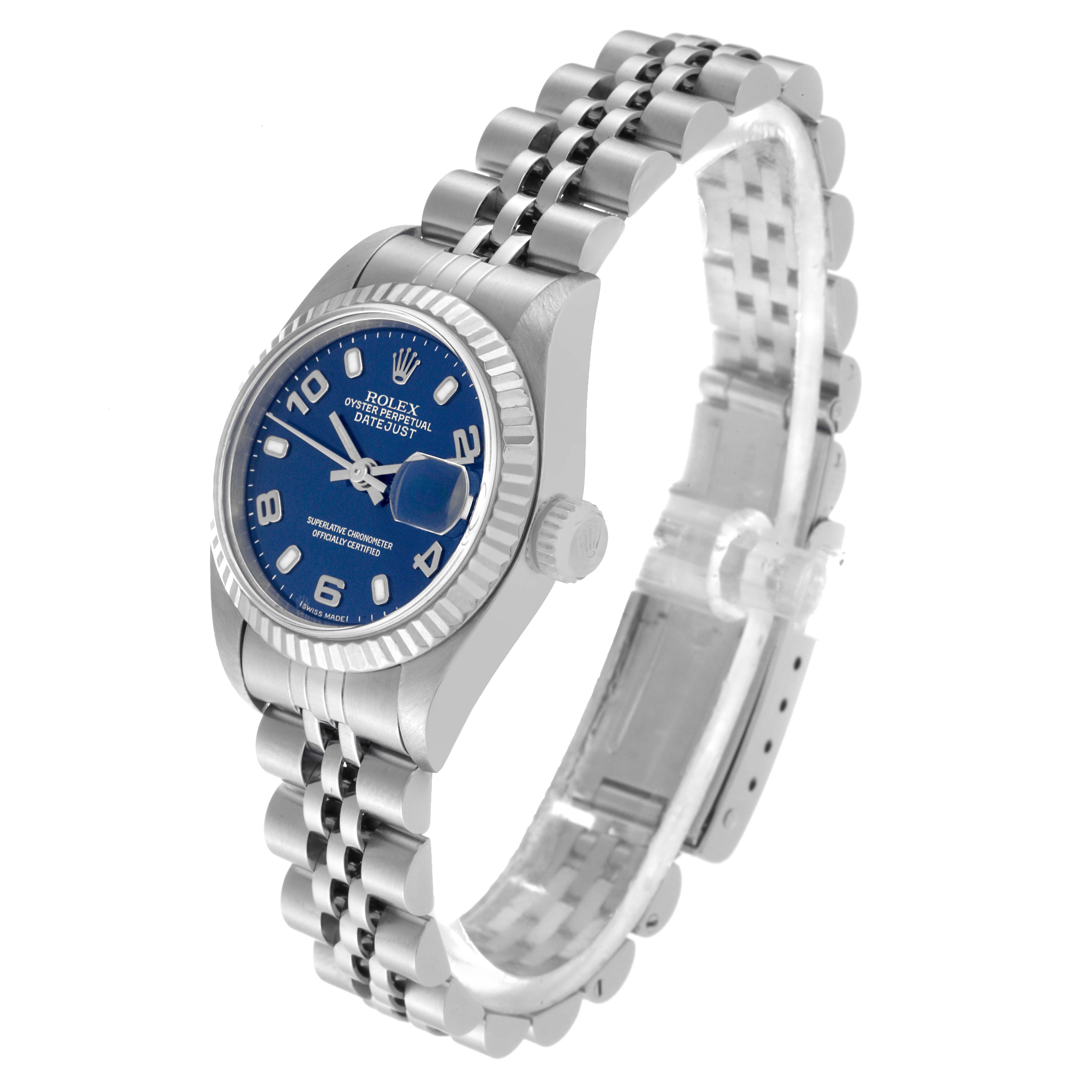 The image shows a Rolex Datejust 79174 Women's Stainless Steel Blue Dial 79174 Women's Stainless Steel Blue Dial watch at a three-quarter angle, featuring a blue dial, fluted bezel, and jubilee bracelet.