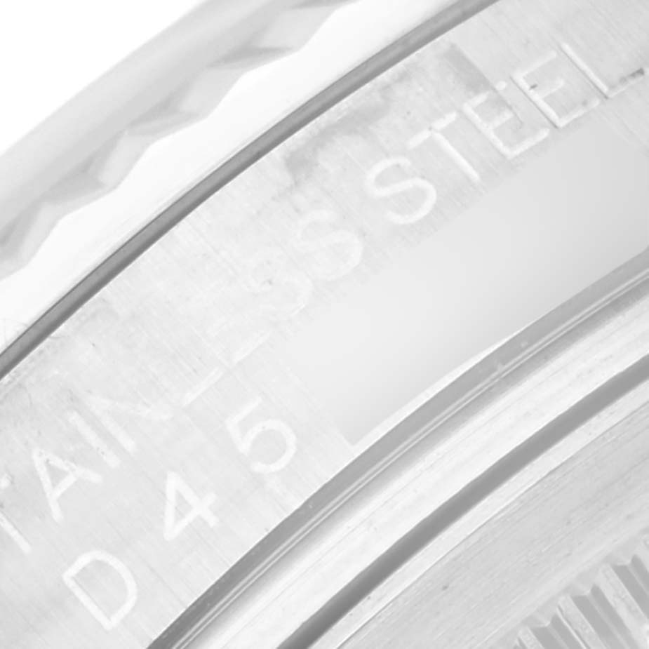 This close-up image shows the edge of the case and part of the bezel of a Rolex Datejust 116234 Men's Stainless Steel White Dial 116234 Men's Stainless Steel White Dial watch, including the "STAINLESS STEEL" engraving.