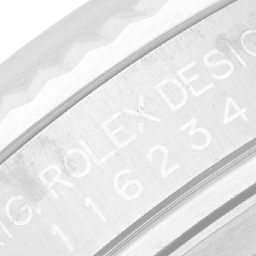 This image shows a close-up of the bezel and engraved serial number on the side of a Rolex Datejust 116234 Men's Stainless Steel White Dial 116234 Men's Stainless Steel White Dial watch.