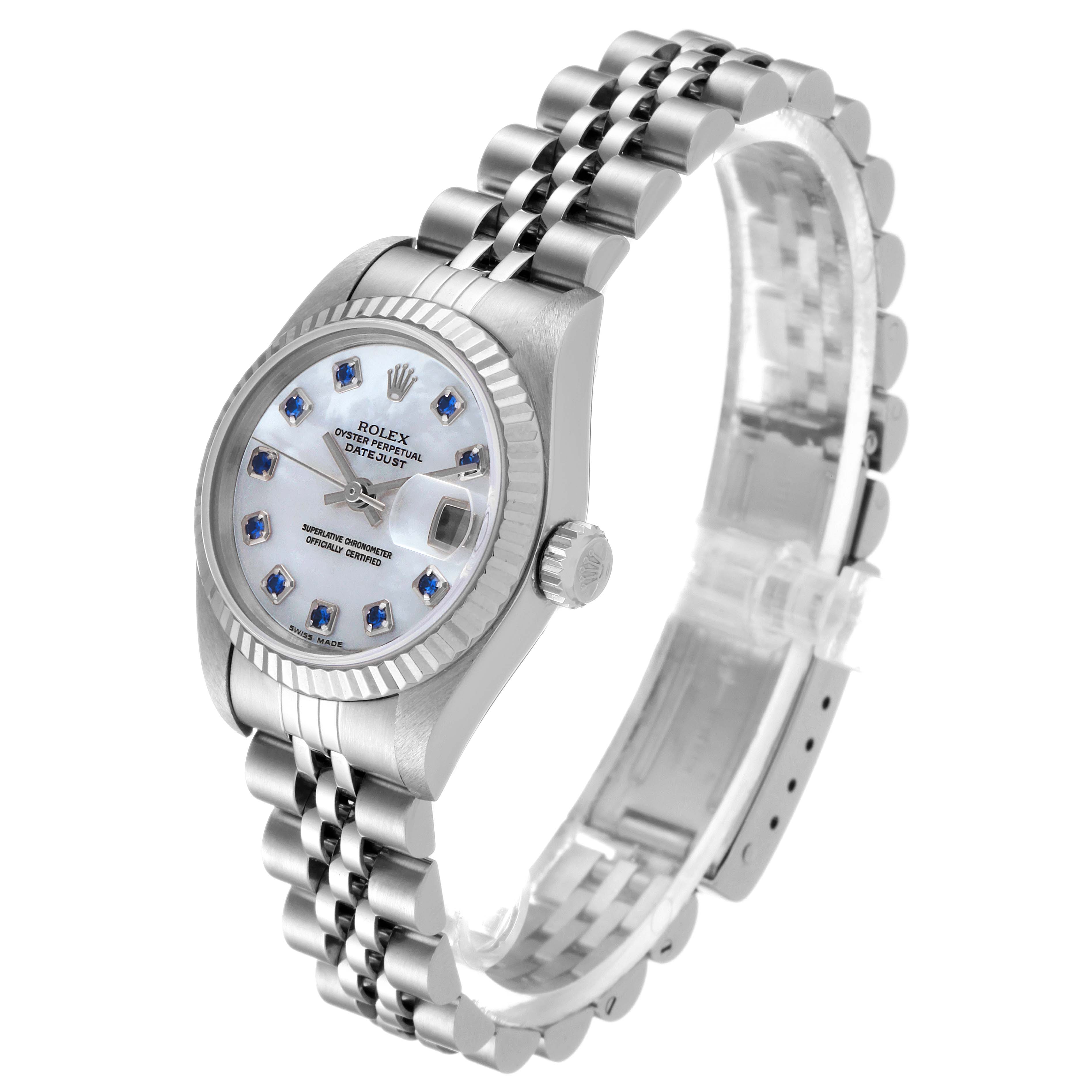 This image shows a side view of the Rolex Datejust 79174 Women
s Stainless Steel Mother of Pearl Dial 79174 Women
s Stainless Steel Mother of Pearl Dial watch, highlighting the dial, crown, and bracelet.