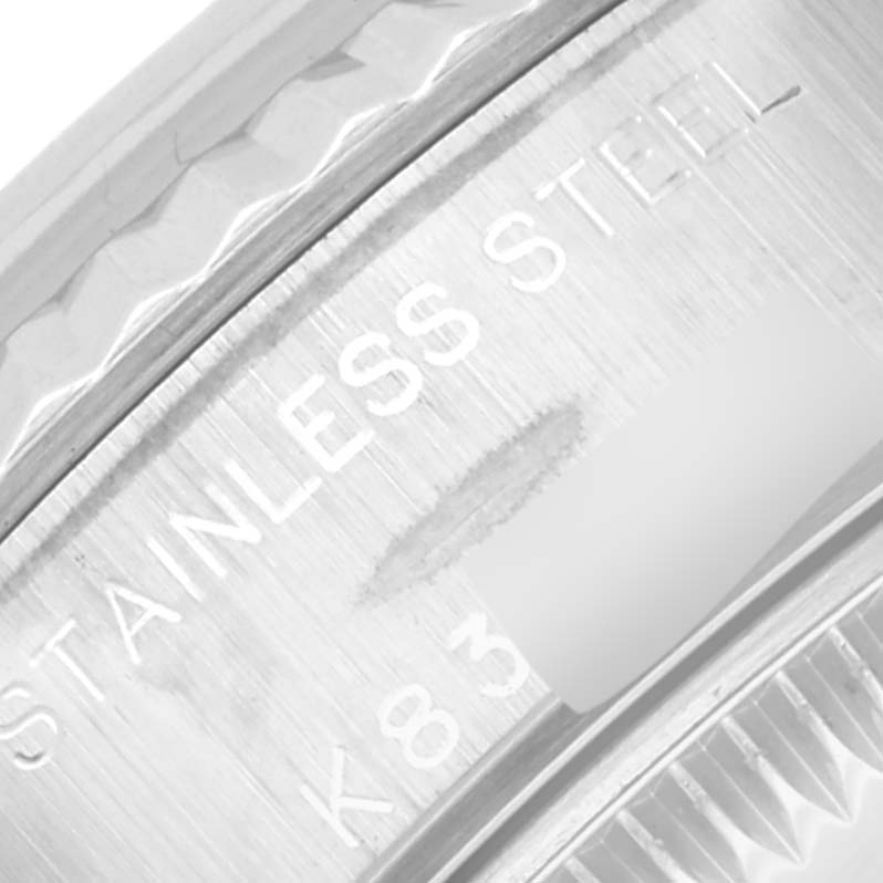 The image shows a close-up of the stainless steel marking on the side of a Rolex Datejust 79174 Women's Stainless Steel Mother of Pearl Dial 79174 Women's Stainless Steel Mother of Pearl Dial watch case.