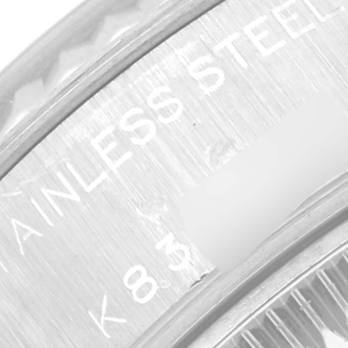 This close-up image shows part of the stainless steel casing and engraving on the Rolex Datejust 79174 Women's Stainless Steel Silver Dial 79174 Women's Stainless Steel Silver Dial watch.