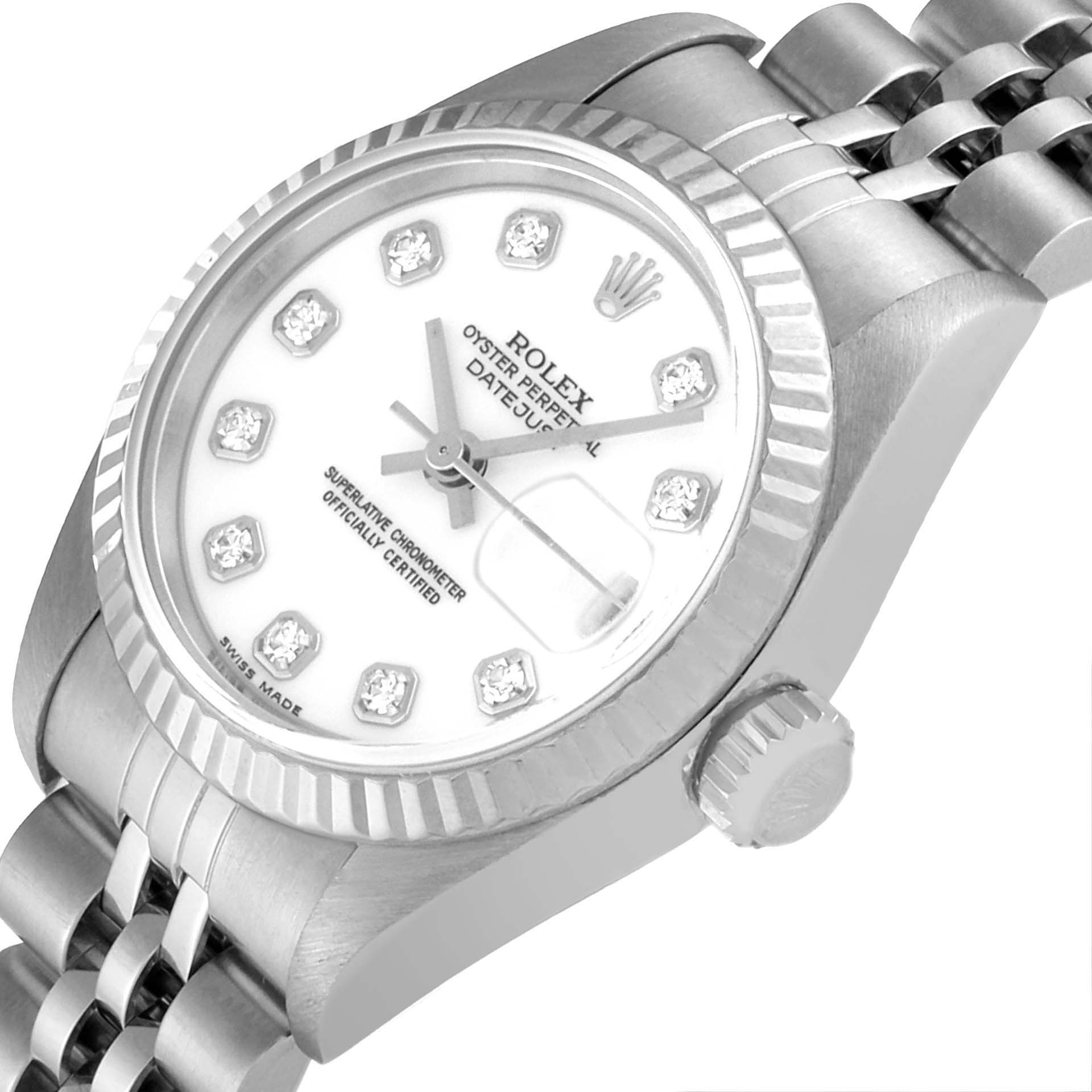 This image shows a Rolex Datejust 79174 Women's Stainless Steel White Dial 79174 Women's Stainless Steel White Dial watch at an angled top view, highlighting the dial, bezel, crown, and part of the bracelet.
