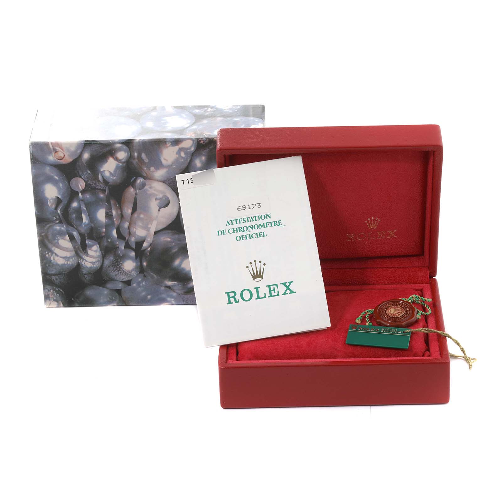 This image shows the Rolex Datejust 69173 Women's Steel and Gold (two tone) Black Dial 69173 Women's Steel and Gold (two tone) Black Dial packaging, including a box, a certificate, and a tag, viewed from the front.