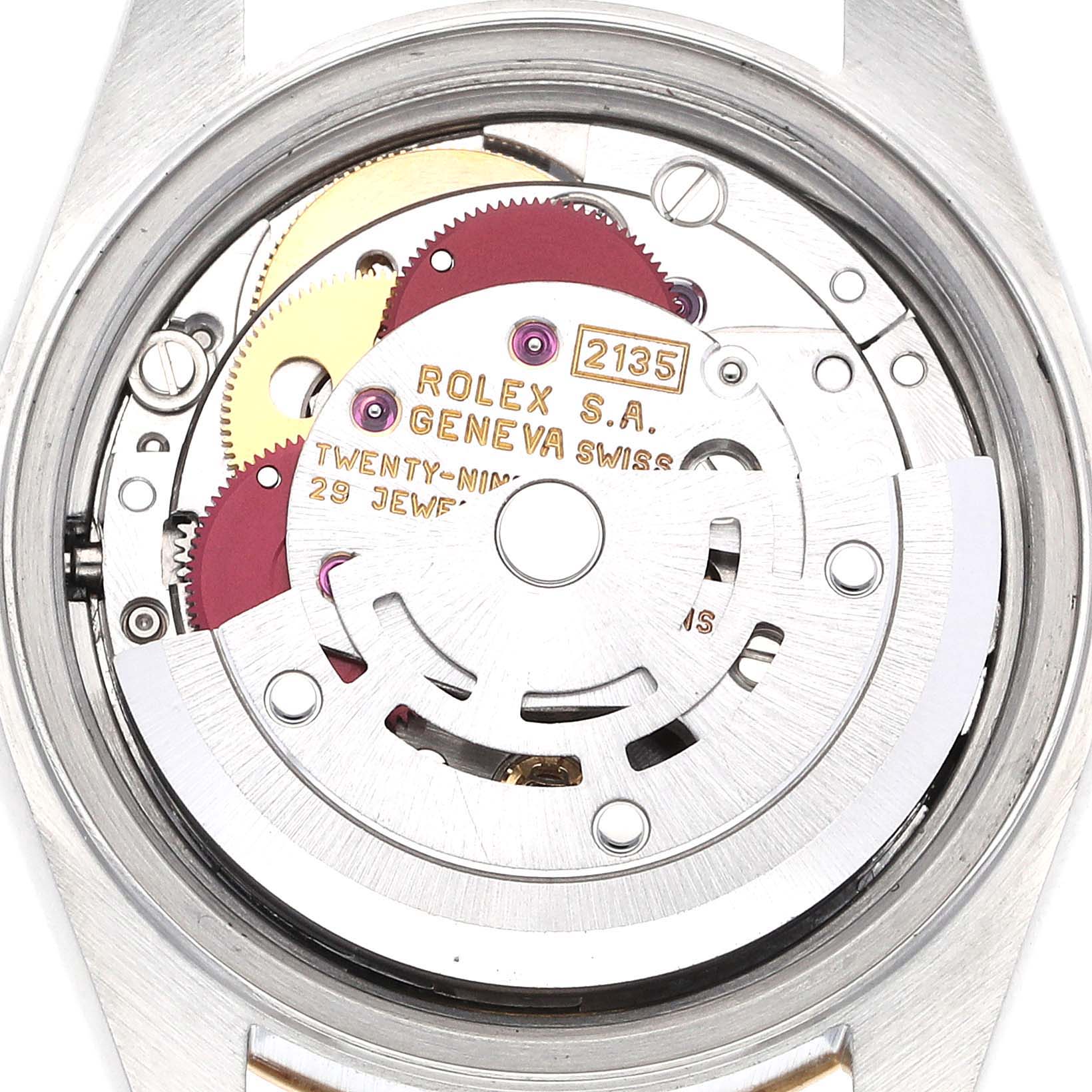 This image shows the intricate internal mechanism of the Rolex Datejust 69173 Women's Steel and Gold (two tone) Black Dial 69173 Women's Steel and Gold (two tone) Black Dial watch, highlighting the 2135 movement and gears.