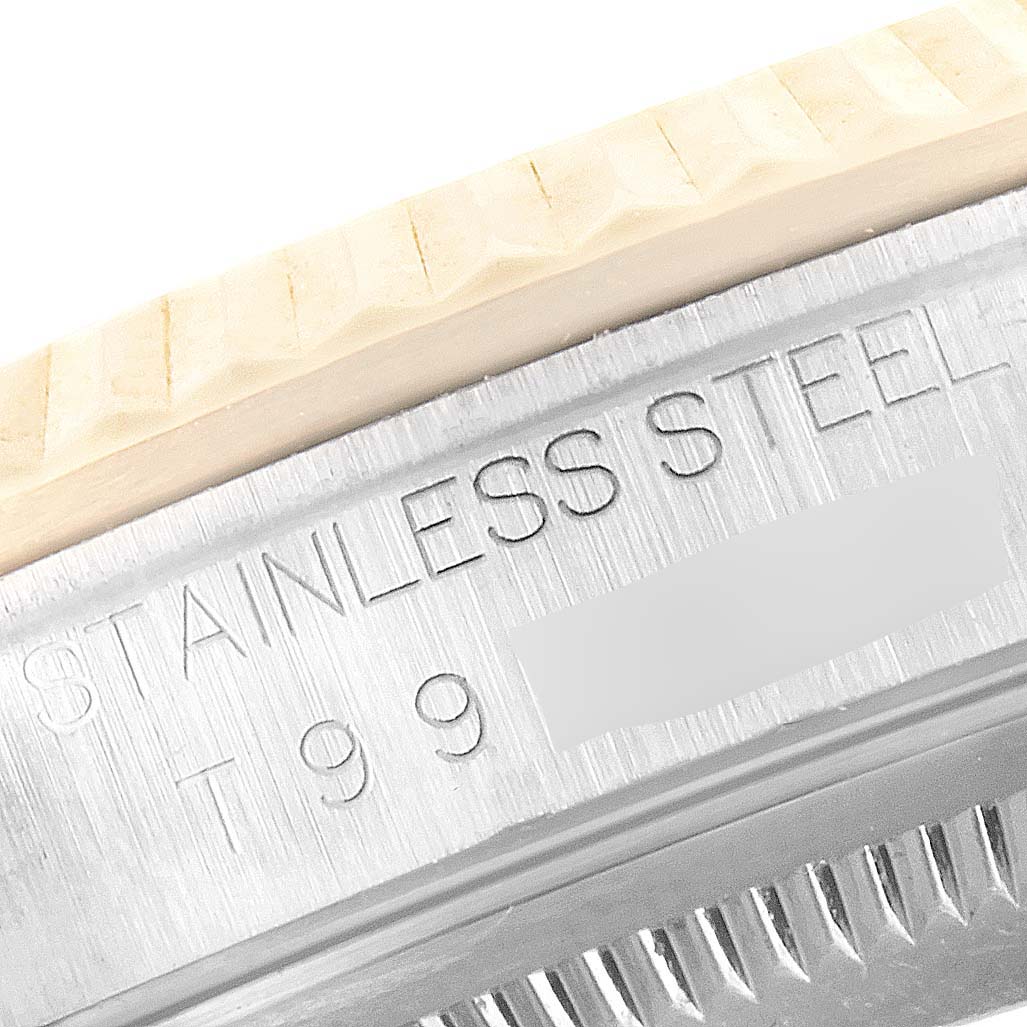 The image shows a close-up of the stainless steel case back with engraved text on a Rolex Datejust 16233 Men's Steel and Gold (two tone) Champagne Dial 16233 Men's Steel and Gold (two tone) Champagne Dial model watch.