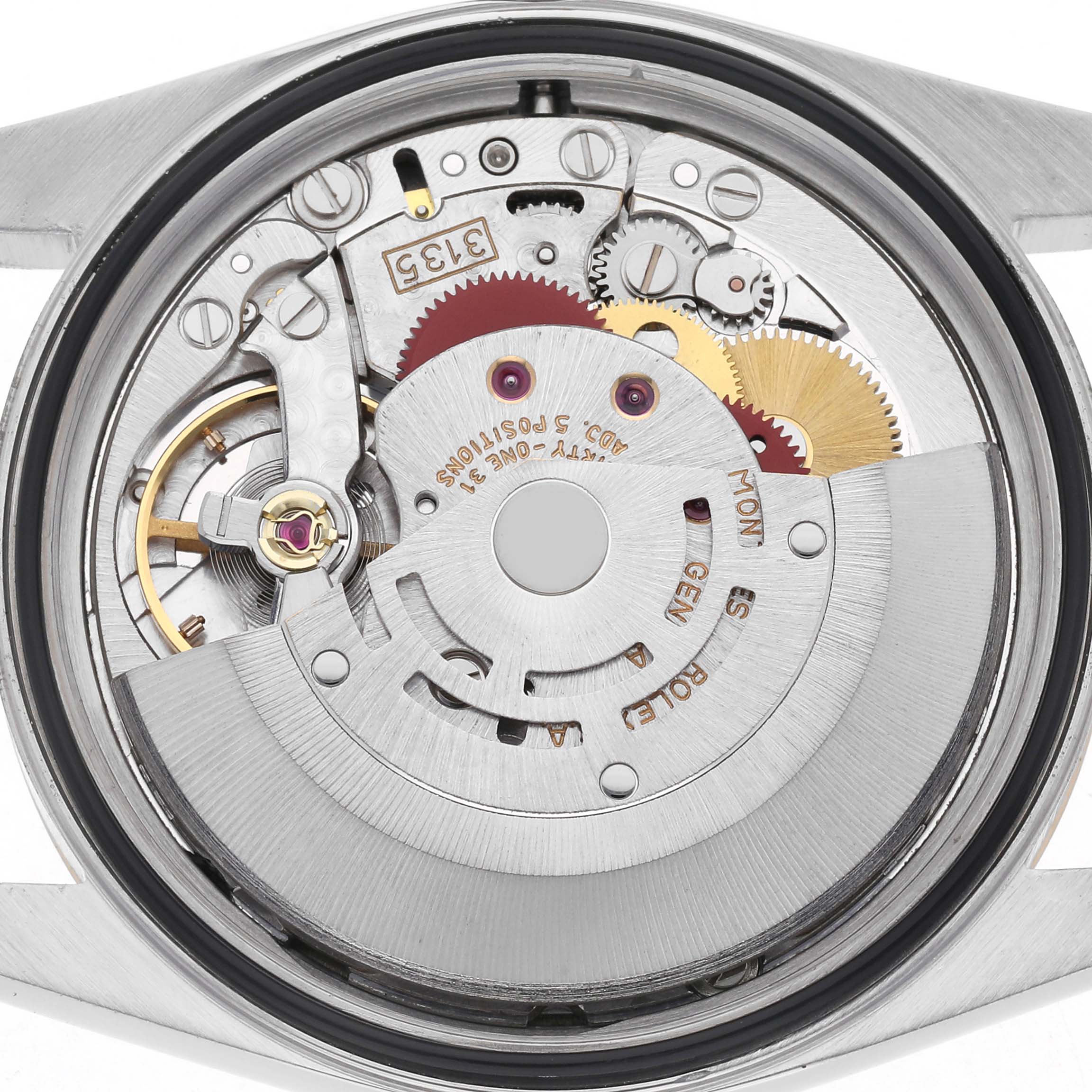 The image shows the movement of a Rolex Datejust 16233 Men's Steel and Gold (two tone) Silver Dial 16233 Men's Steel and Gold (two tone) Silver Dial watch from a top-down angle, highlighting gears and mechanisms.