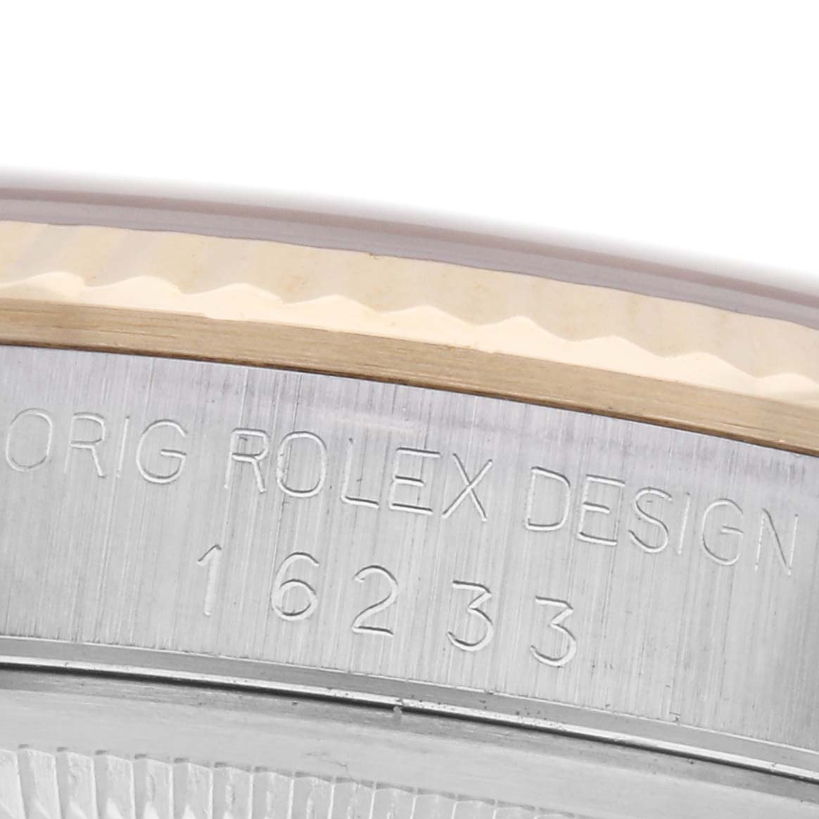 The image shows a close-up of the side engraving on the Rolex Datejust 16233 Men's Steel and Gold (two tone) Silver Dial 16233 Men's Steel and Gold (two tone) Silver Dial watch case, focusing on the model number.