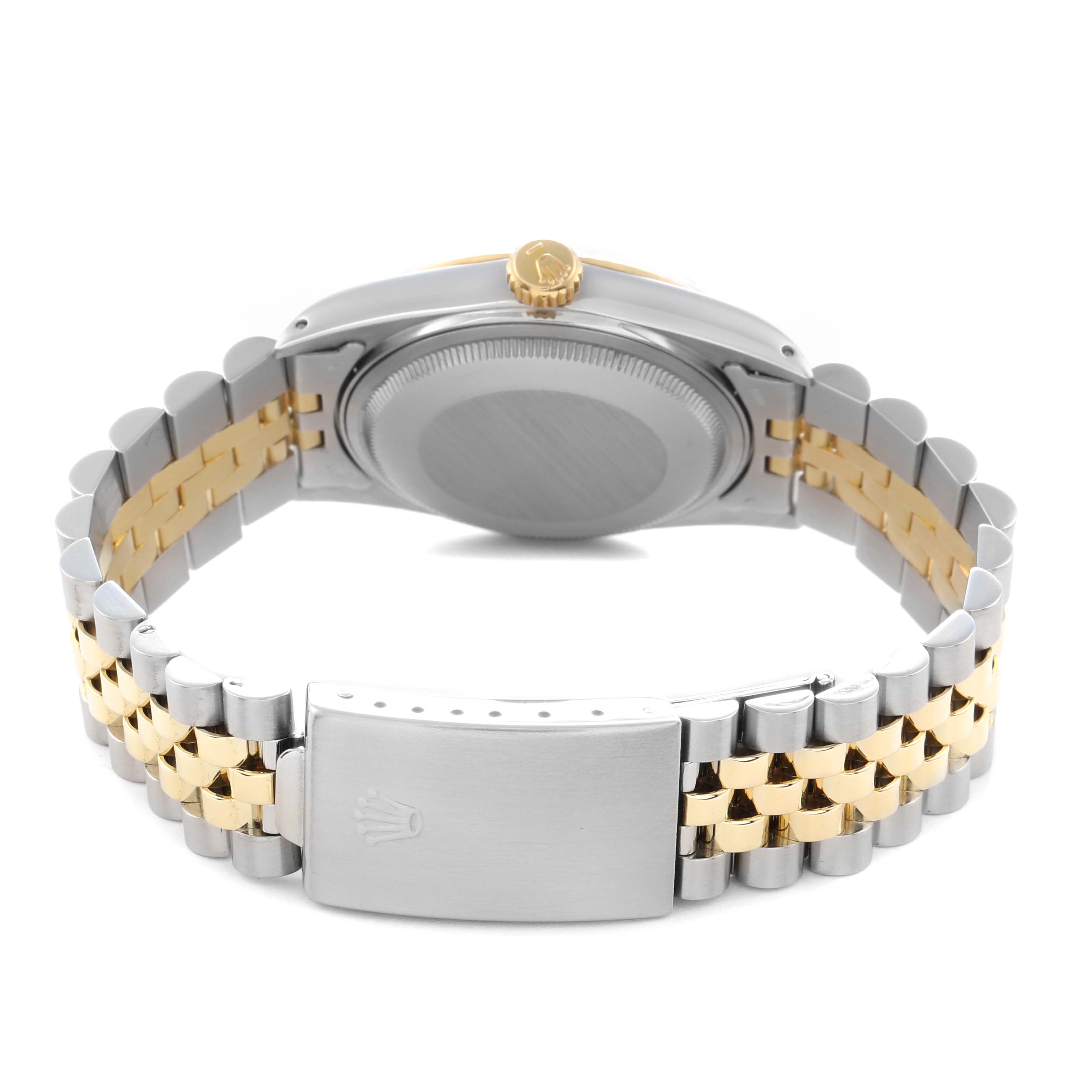 The Rolex Datejust 16013 Men's Steel and Gold (two tone) White Dial 16013 Men's Steel and Gold (two tone) White Dial watch is shown from the back, highlighting the clasp, bracelet, and case back in a two-tone design.