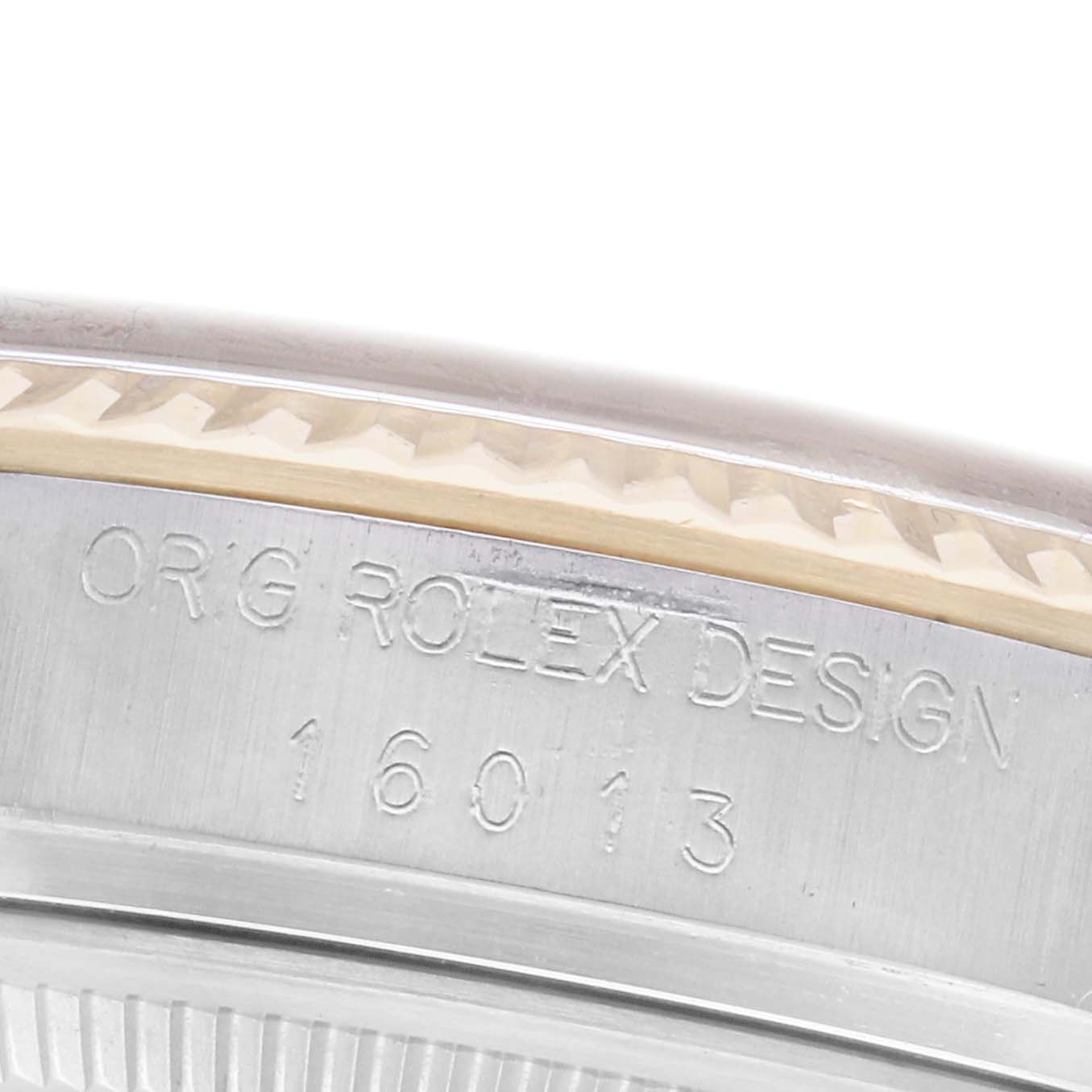 The image shows a close-up of the case side of a Rolex Datejust 16013 Men's Steel and Gold (two tone) White Dial 16013 Men's Steel and Gold (two tone) White Dial, highlighting the engraving details.