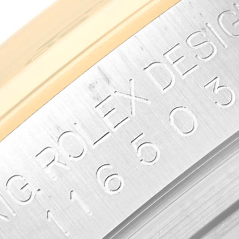 The image shows a close-up of the serial and model number engraving on the side of a Rolex Daytona 116503 Men's Steel and Gold (two tone) Black Dial 116503 Men's Steel and Gold (two tone) Black Dial watch case.