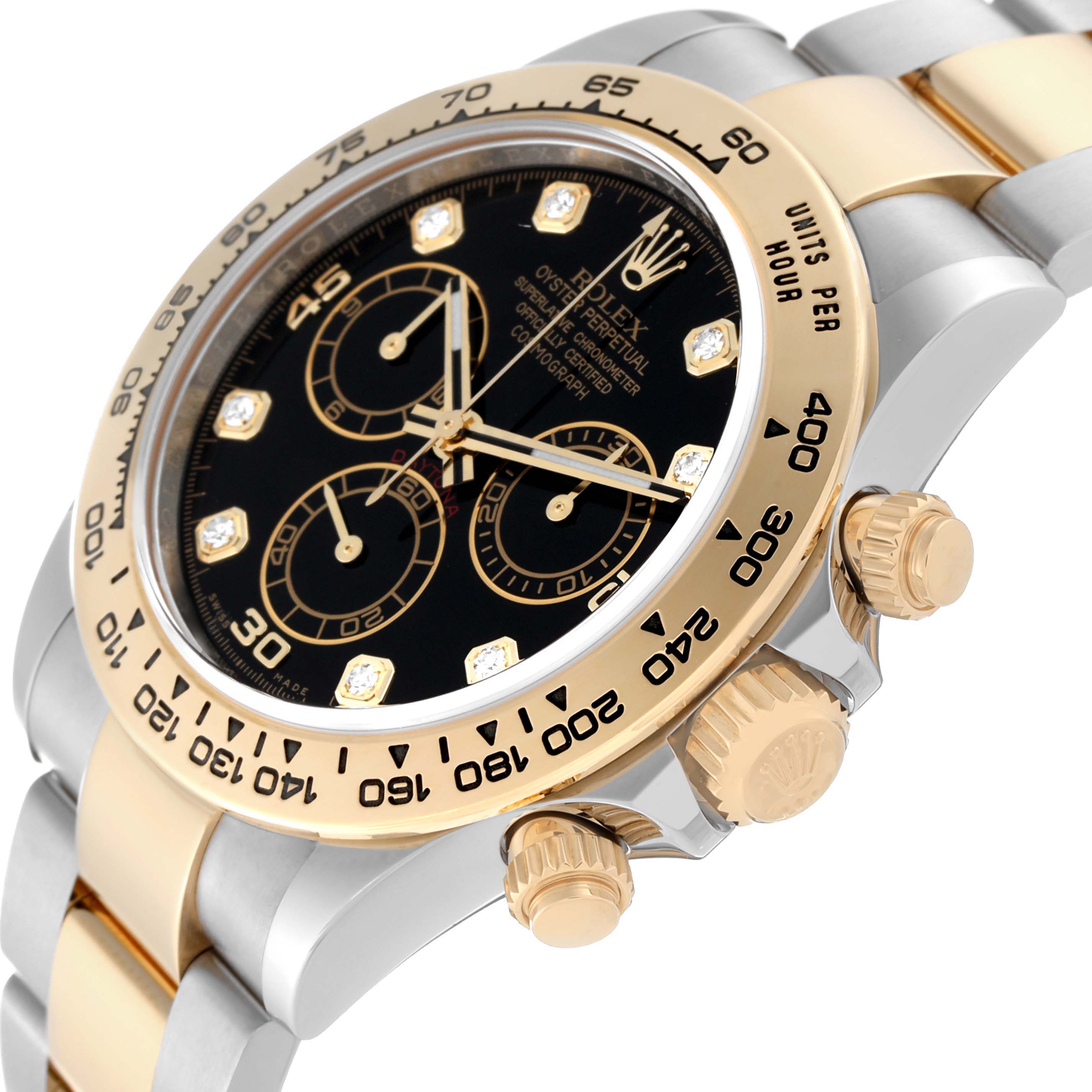 This image shows the Rolex Daytona 116503 Men's Steel and Gold (two tone) Black Dial 116503 Men's Steel and Gold (two tone) Black Dial watch at an angle, displaying its black dial, gold bezel, and crown controls.