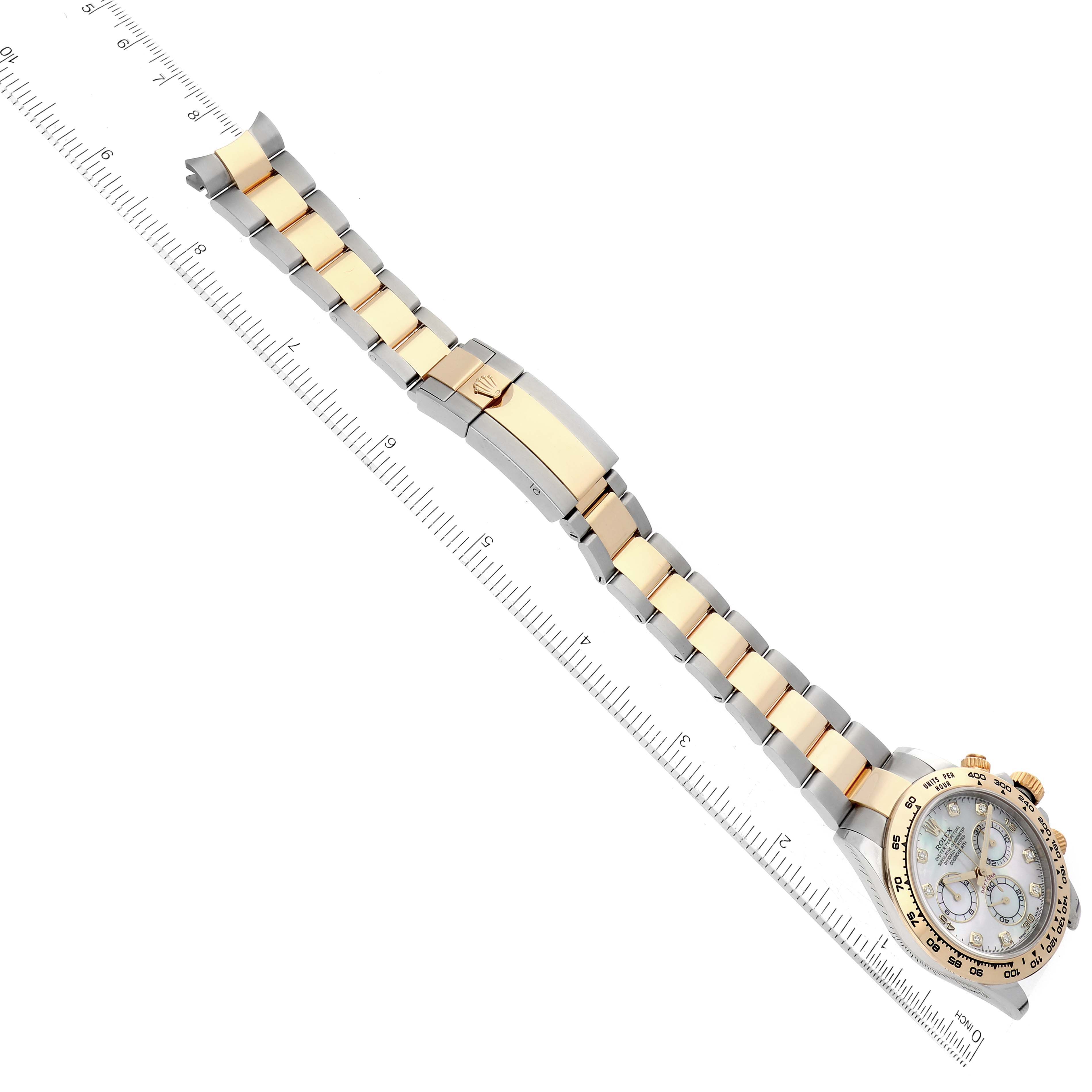 The image shows a top-down view of a Rolex Daytona 116503 Men's Steel and Gold (two tone) Mother of Pearl Dial 116503 Men's Steel and Gold (two tone) Mother of Pearl Dial watch, including the bracelet and clasp, placed next to a ruler for scale.