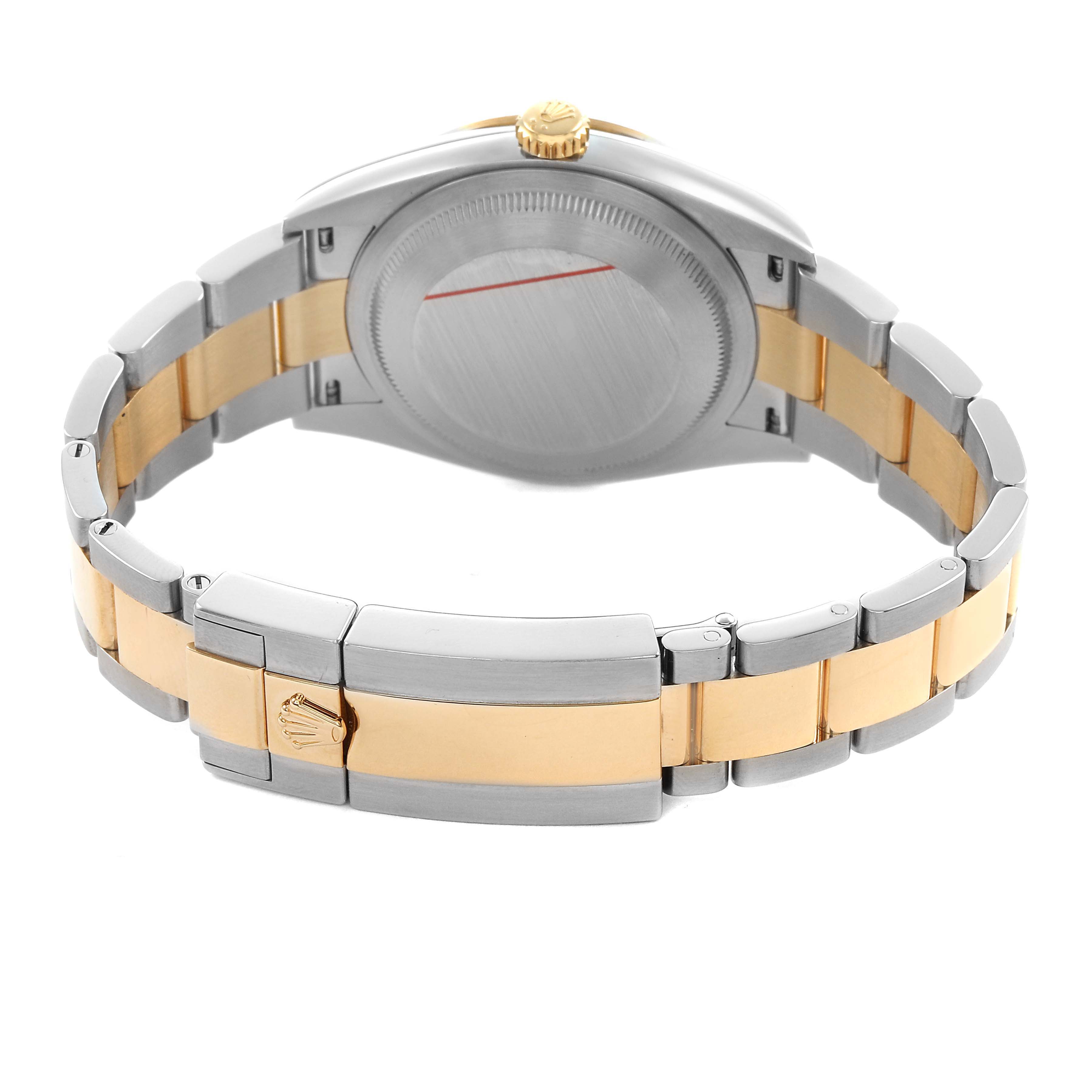 The image shows the back and clasp of a Rolex Explorer 124273 Men's Steel and Gold (two tone) Black Dial watch, highlighting the two-tone bracelet design.