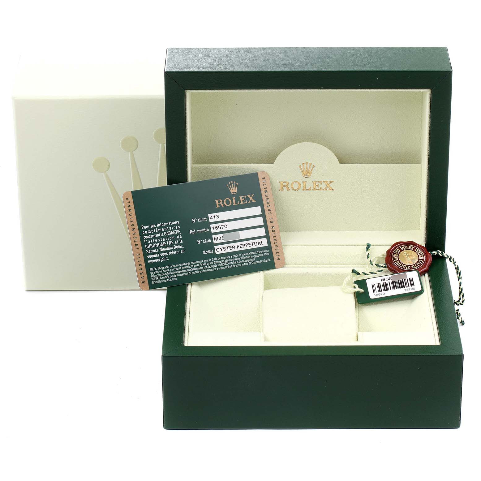 The image shows the packaging, certificate, and tags for a Rolex Explorer 16570 Men
s Stainless Steel White Dial 16570 Men
s Stainless Steel White Dial watch at an angle.