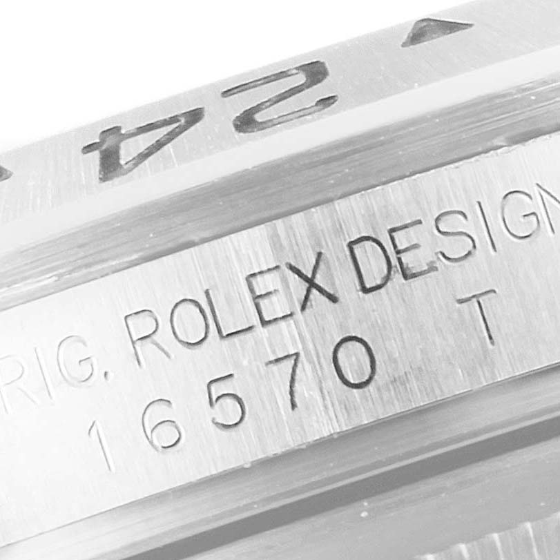 This image shows a close-up of the side of a Rolex Explorer 16570 Men
s Stainless Steel White Dial 16570 Men
s Stainless Steel White Dial model, focusing on the model number "16570" engraving.