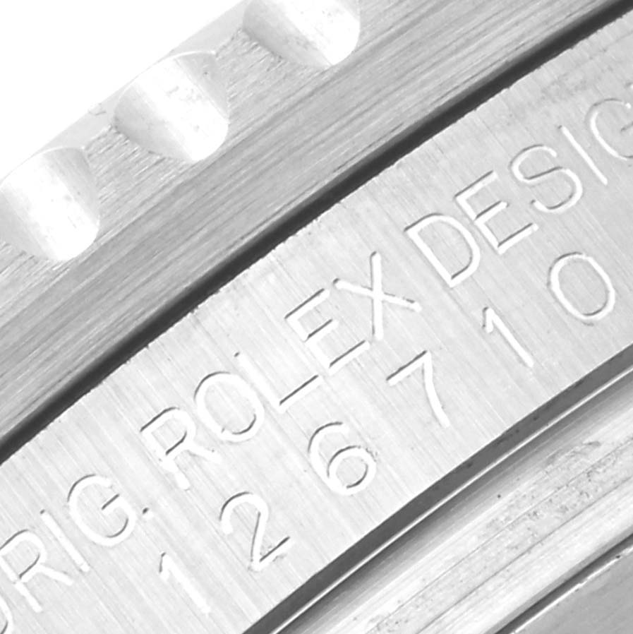 The close-up image shows the engraved bezel and serial number on the side of a Rolex GMT-Master 126710 Men
s Stainless Steel Black Dial 126710 Men
s Stainless Steel Black Dial watch.