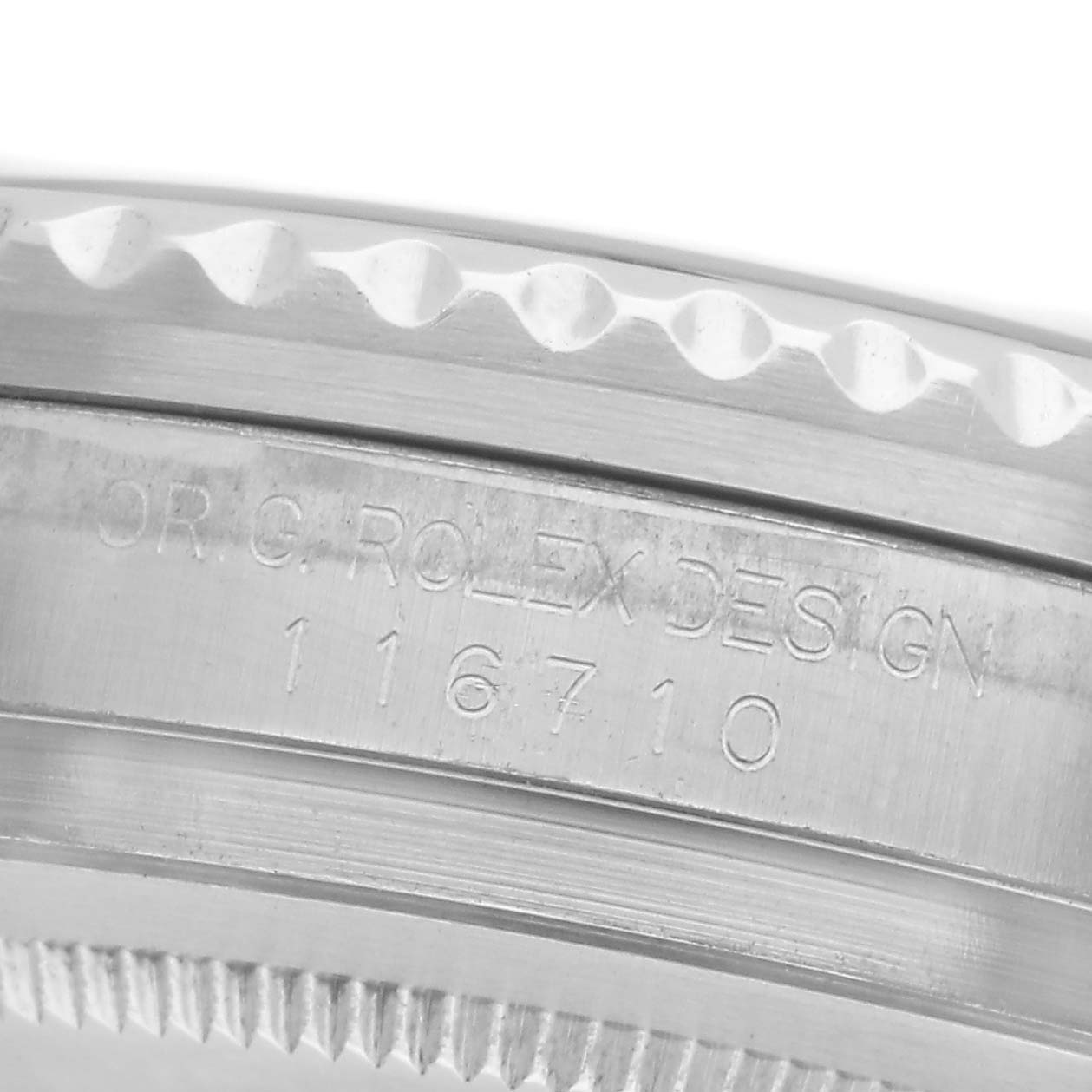 The image shows a close-up of the side of a Rolex GMT-Master 116710 Men's Stainless Steel Black Dial 116710 Men's Stainless Steel Black Dial watch case, highlighting its engraved serial number and design details.
