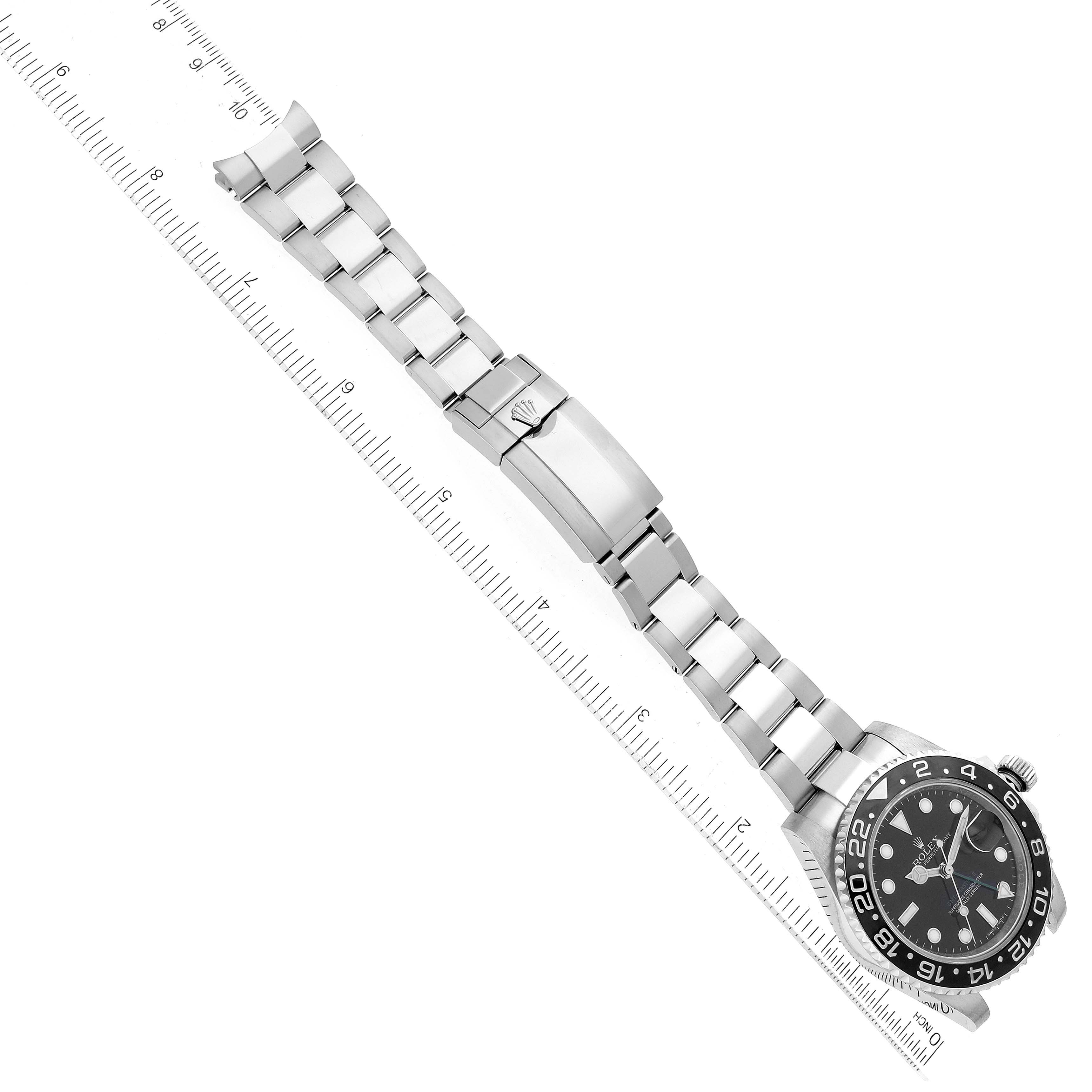 The image shows a top-down view of a Rolex GMT-Master 116710 Men's Stainless Steel Black Dial 116710 Men's Stainless Steel Black Dial watch, highlighting its bracelet, clasp, and dial.